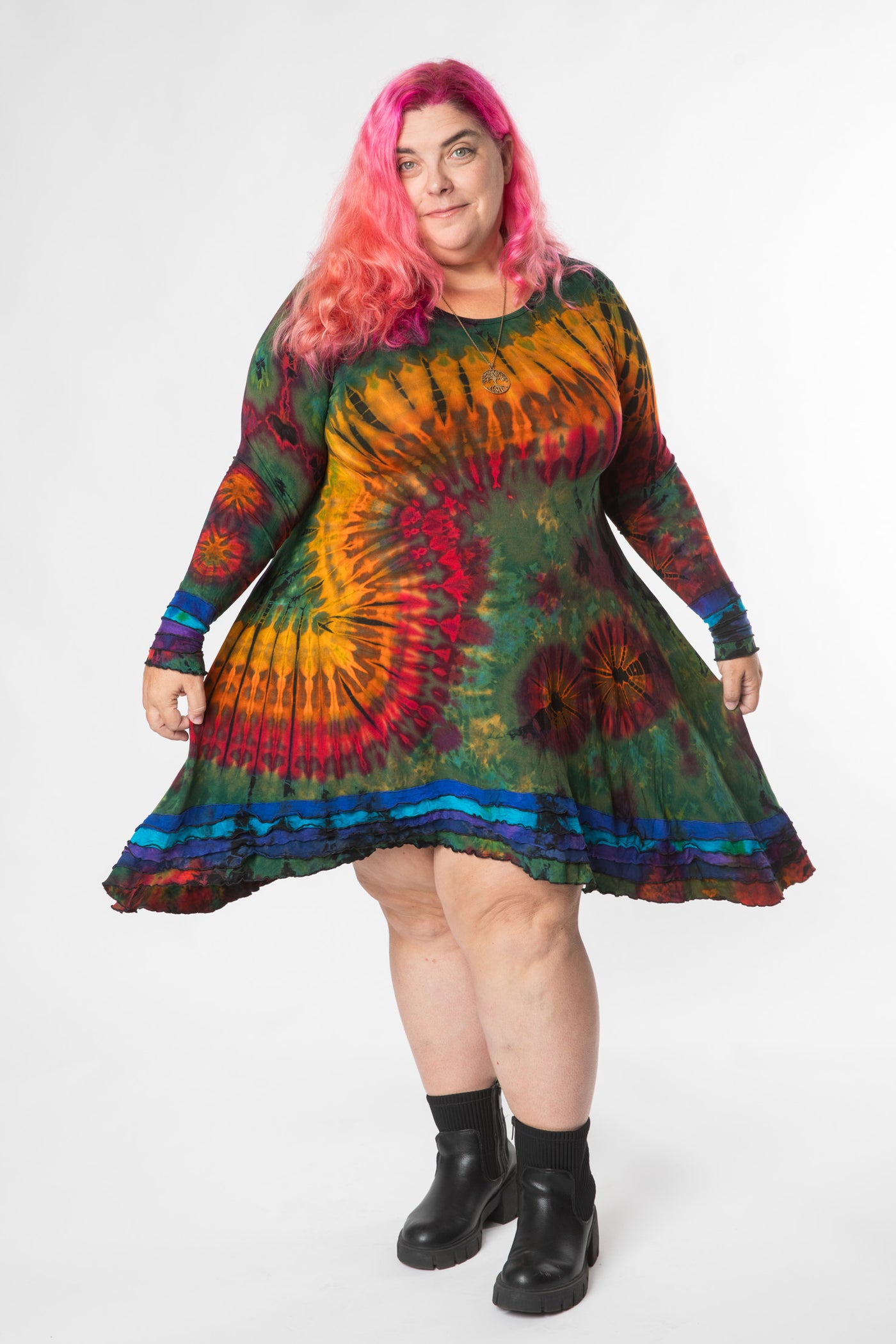 Angel is wearing long sleeve tie dye dress in green