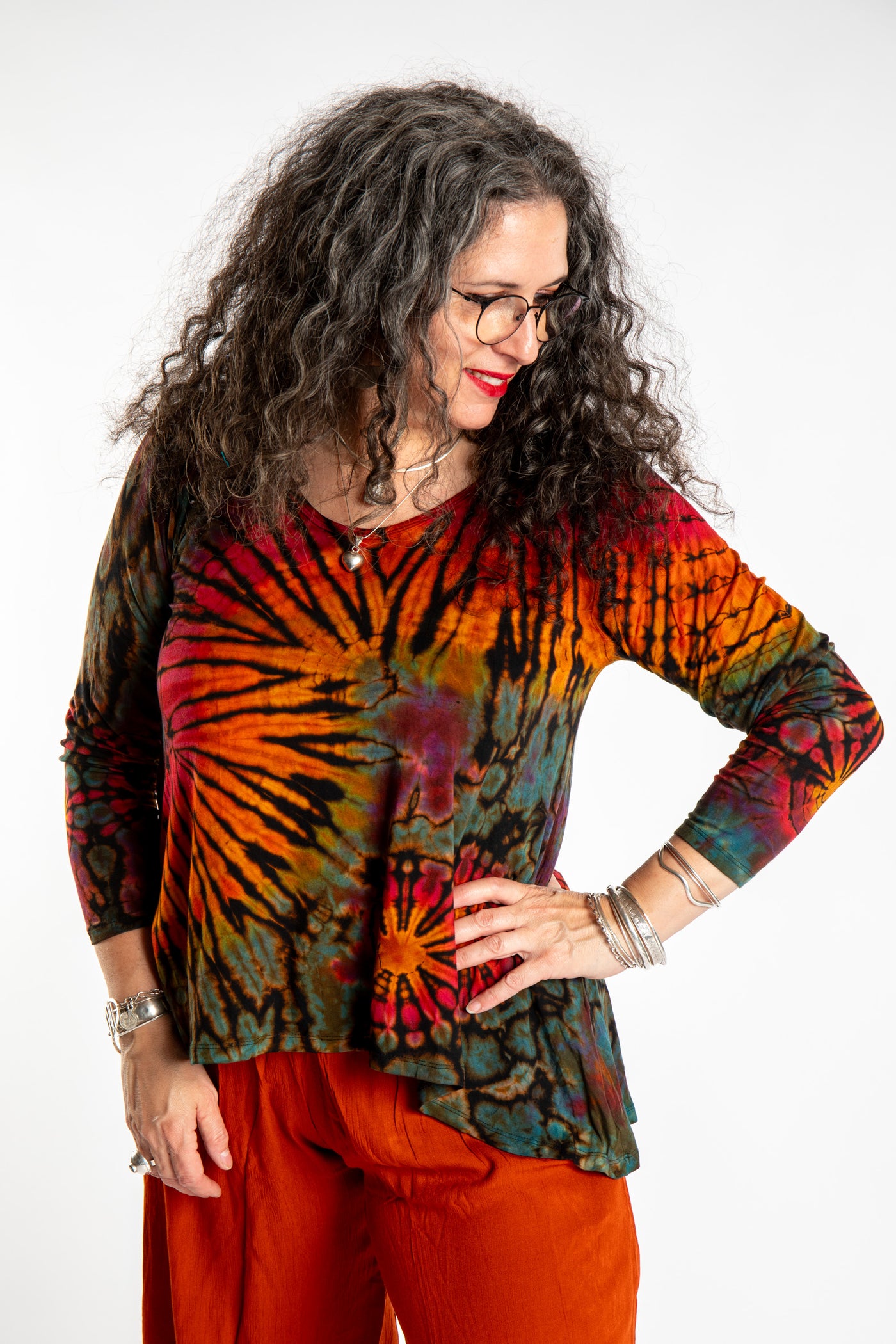 Susan wearing the black rainbow tie dye long sleeve shirt
