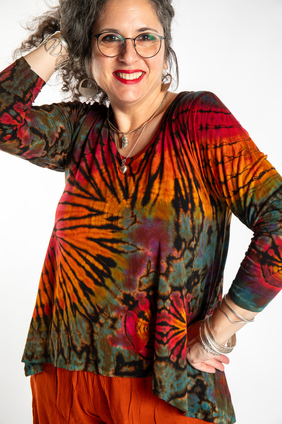 Susan wearing the black rainbow tie dye long sleeve shirt