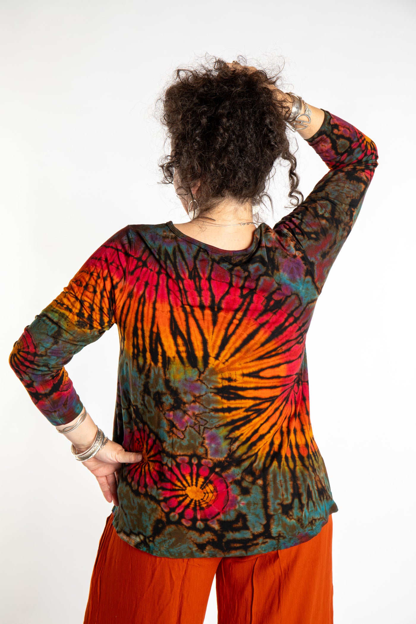 Susan wearing the black rainbow tie dye long sleeve shirt