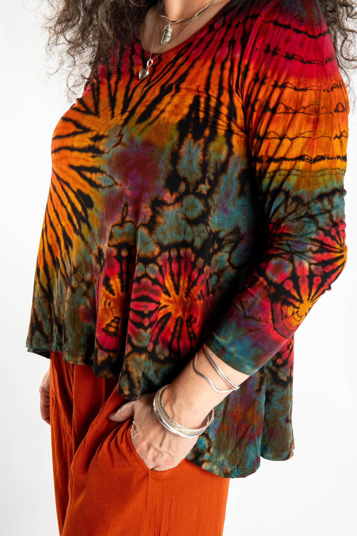 Susan wearing the black rainbow tie dye long sleeve shirt
