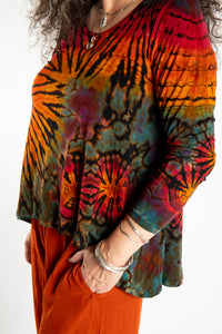 Susan wearing the black rainbow tie dye long sleeve shirt