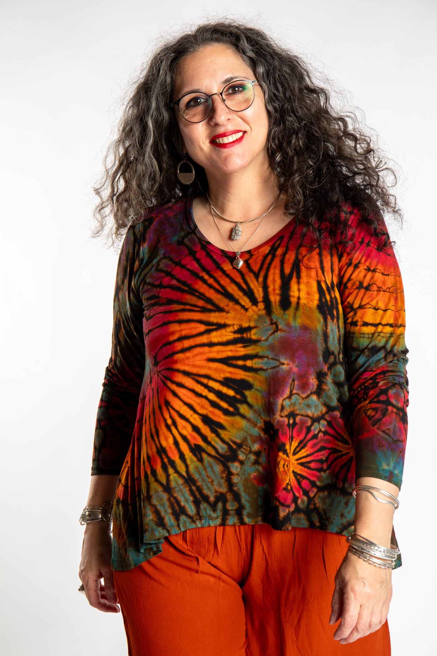 Susan wearing the black rainbow tie dye long sleeve shirt