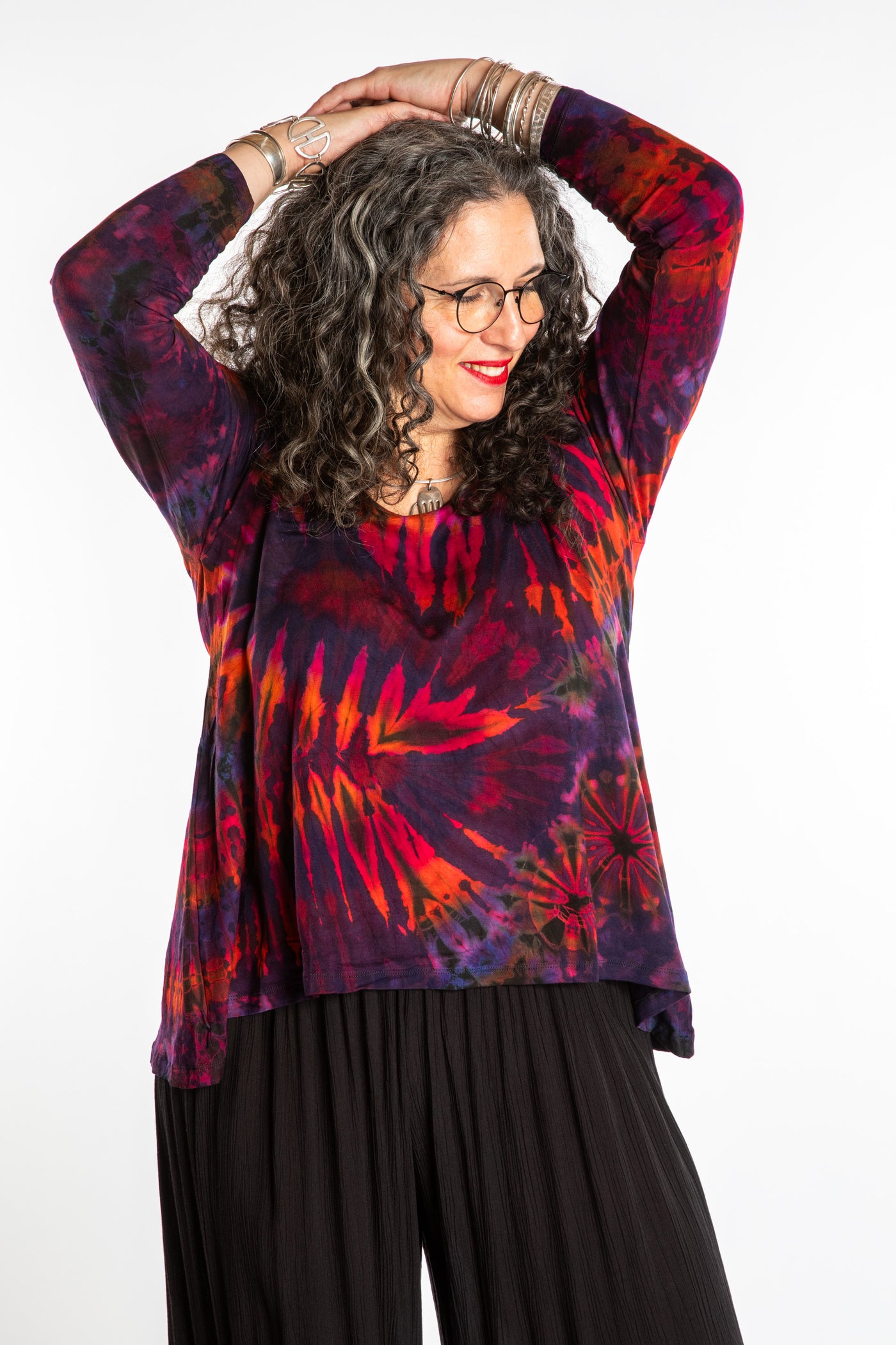 Susan wearing a purple long sleeve tie dye shirt in Eggplant