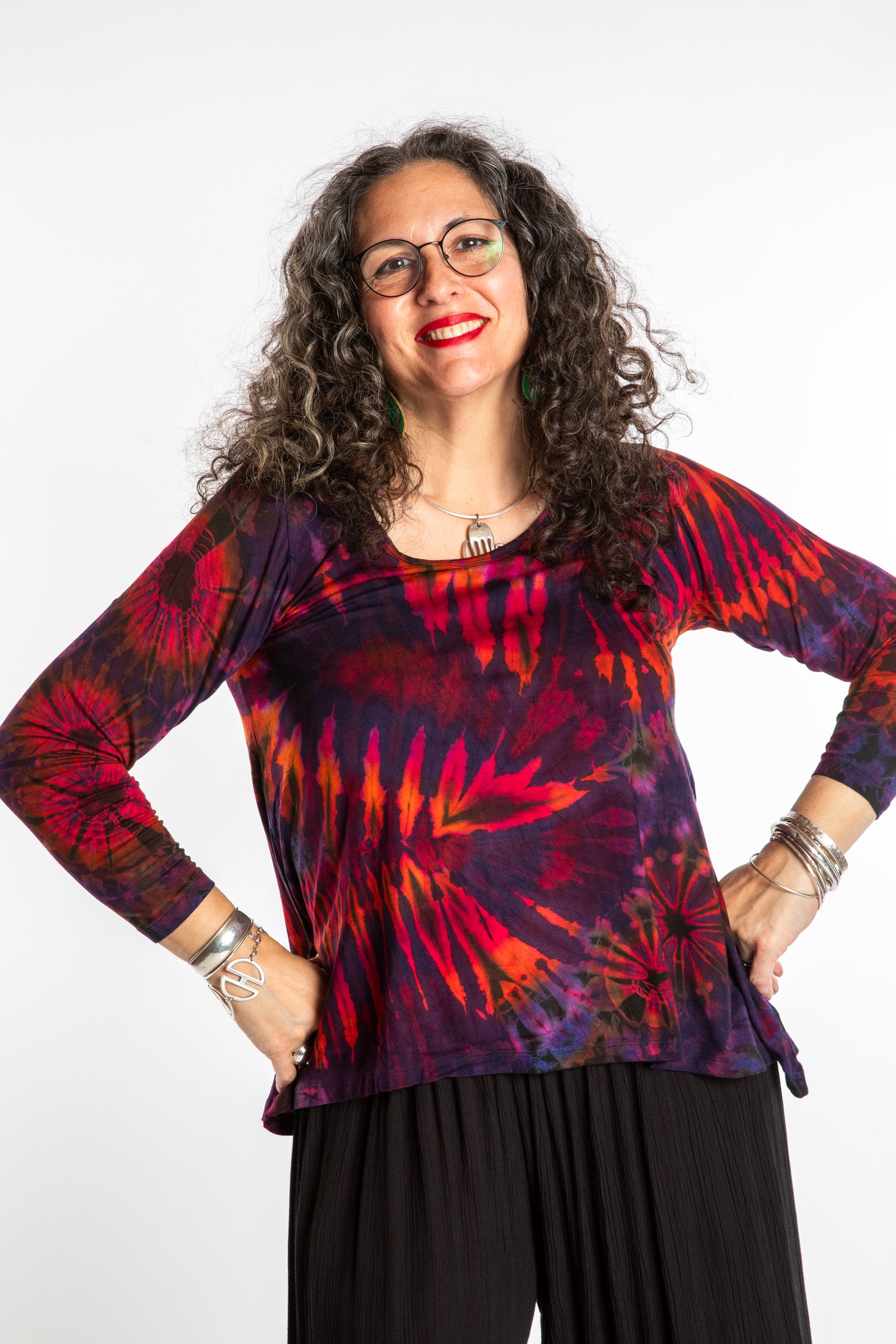 Susan wearing a purple long sleeve tie dye shirt in Eggplant