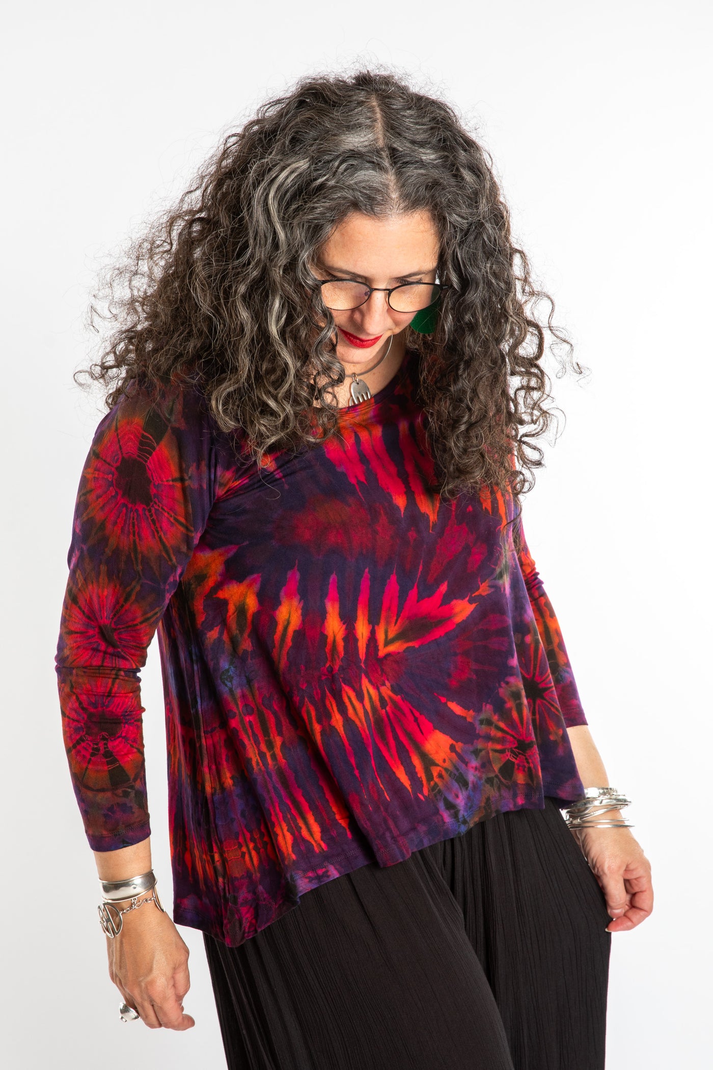Susan wearing a purple long sleeve tie dye shirt in Eggplant