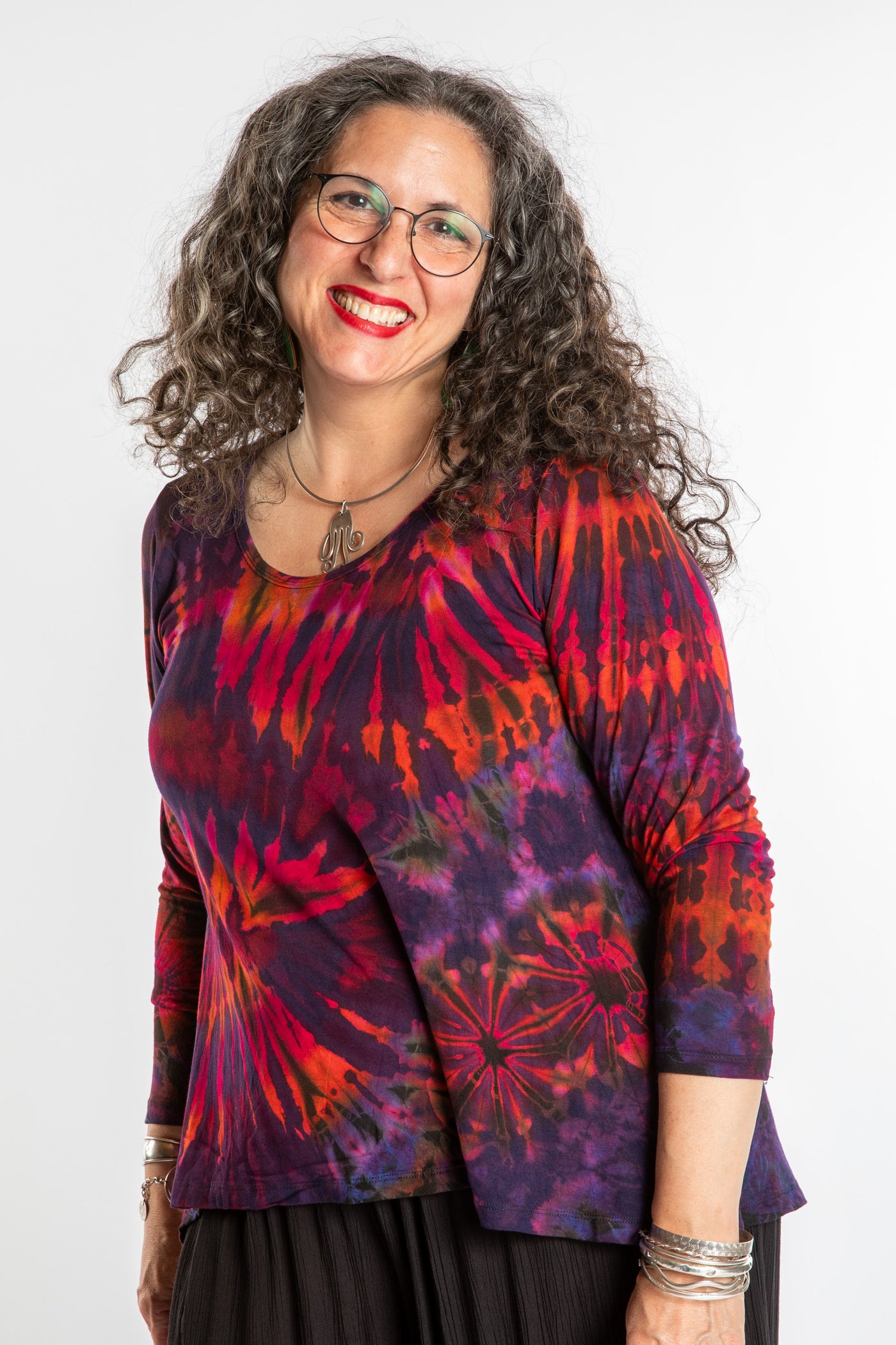 Susan wearing a purple long sleeve tie dye shirt in Eggplant