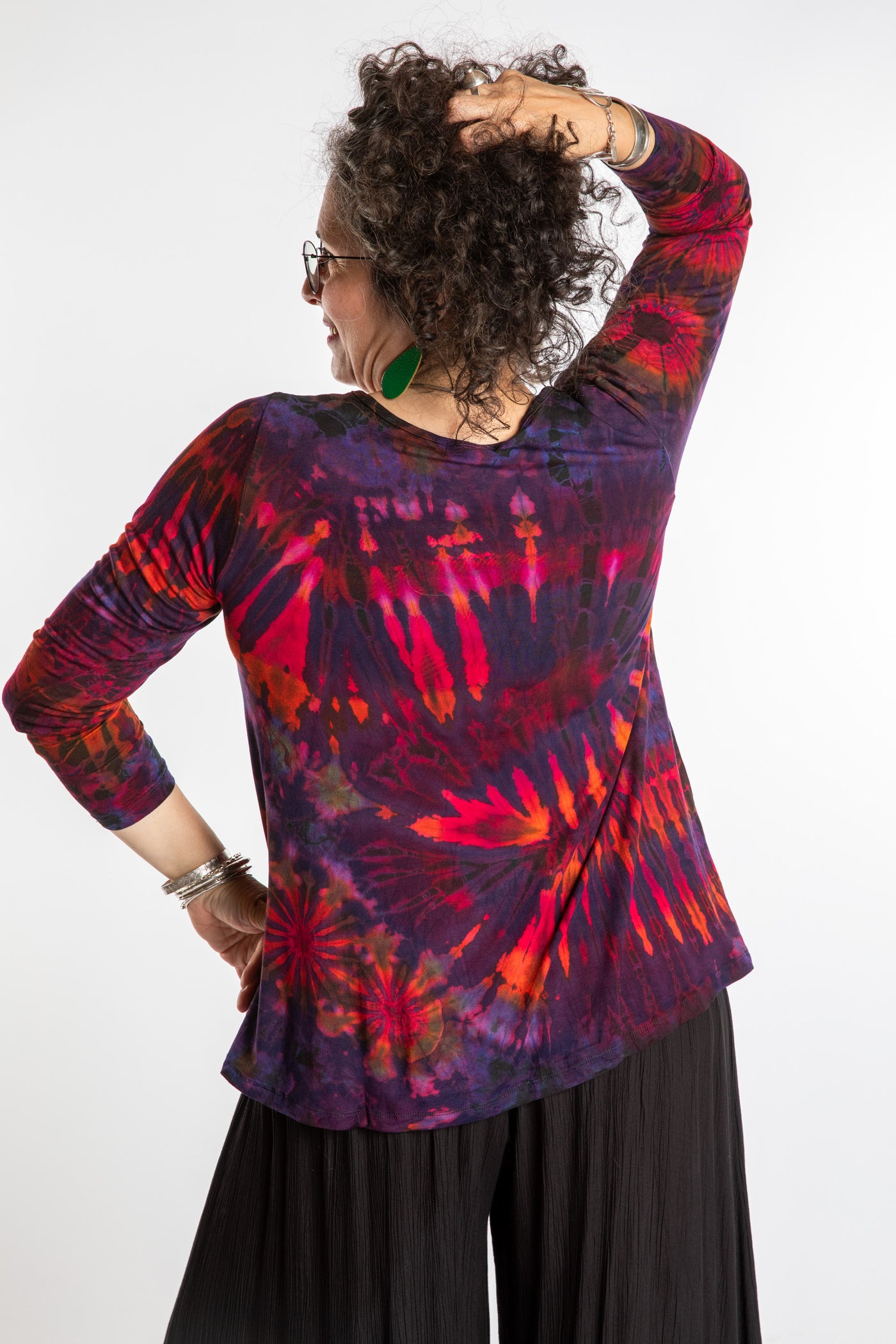 Susan wearing a purple long sleeve tie dye shirt in Eggplant