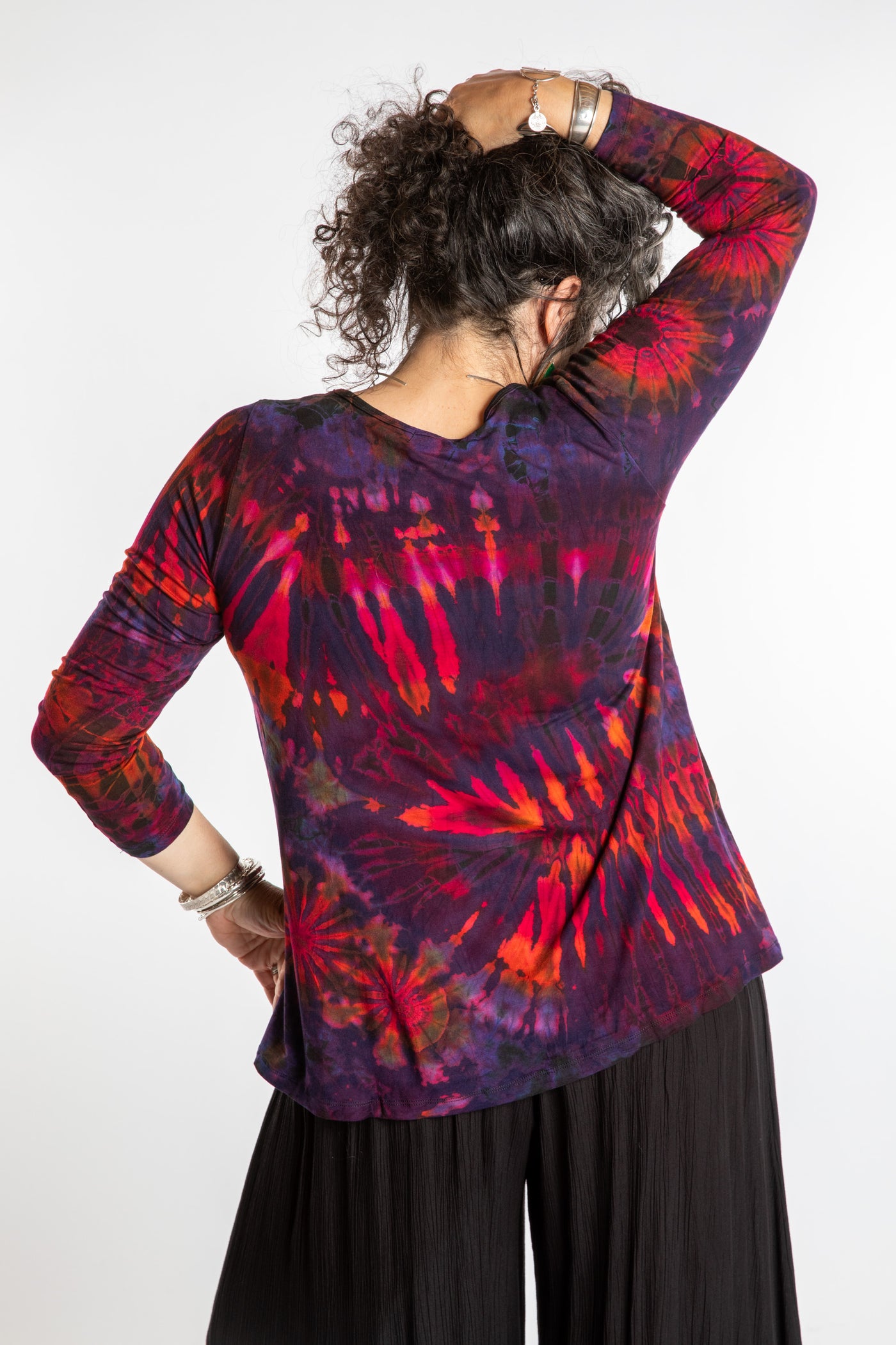 Susan wearing a purple long sleeve tie dye shirt in Eggplant