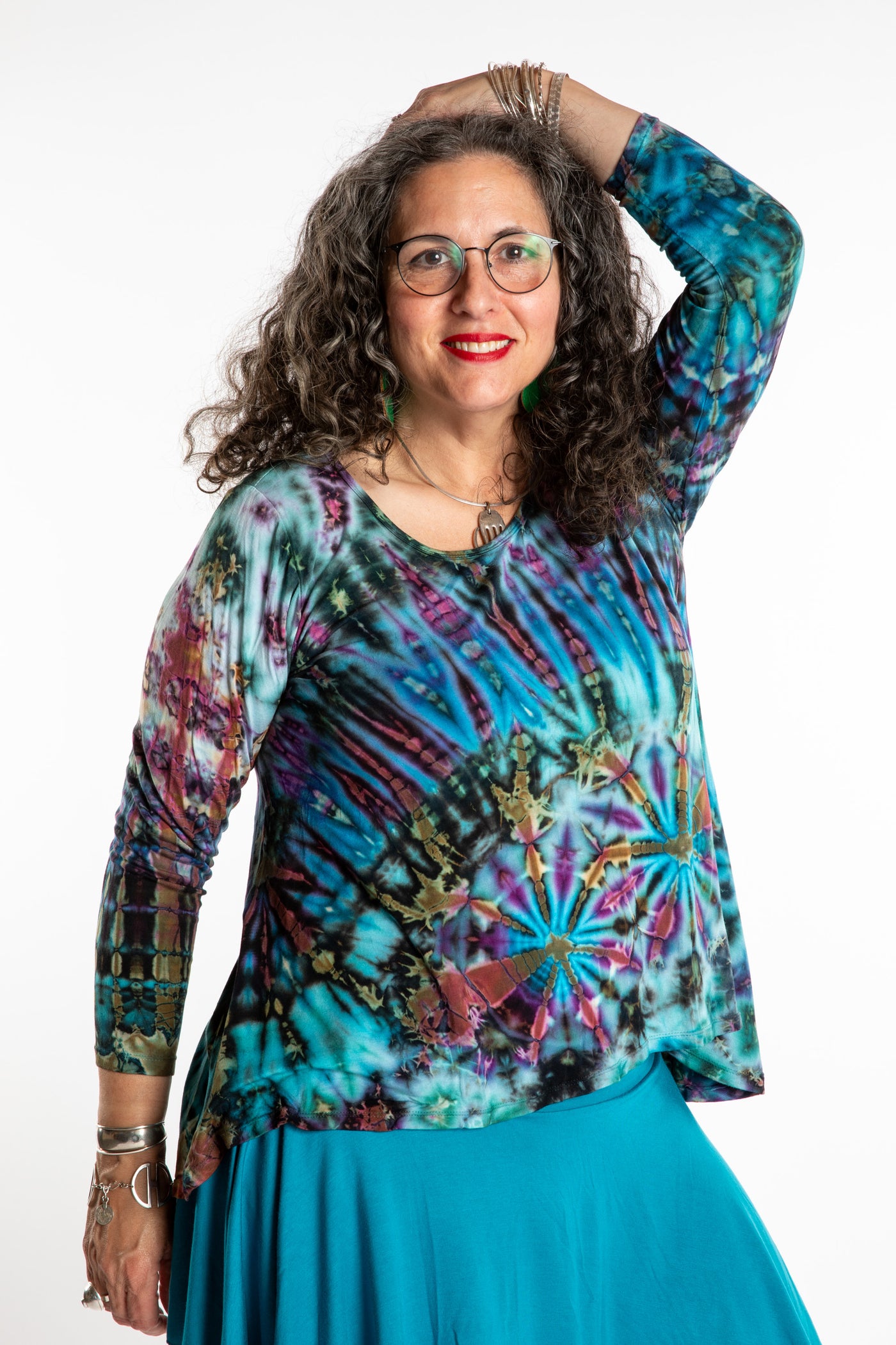 Susan wearing a blue long sleeve tie dye shirt in Ocean