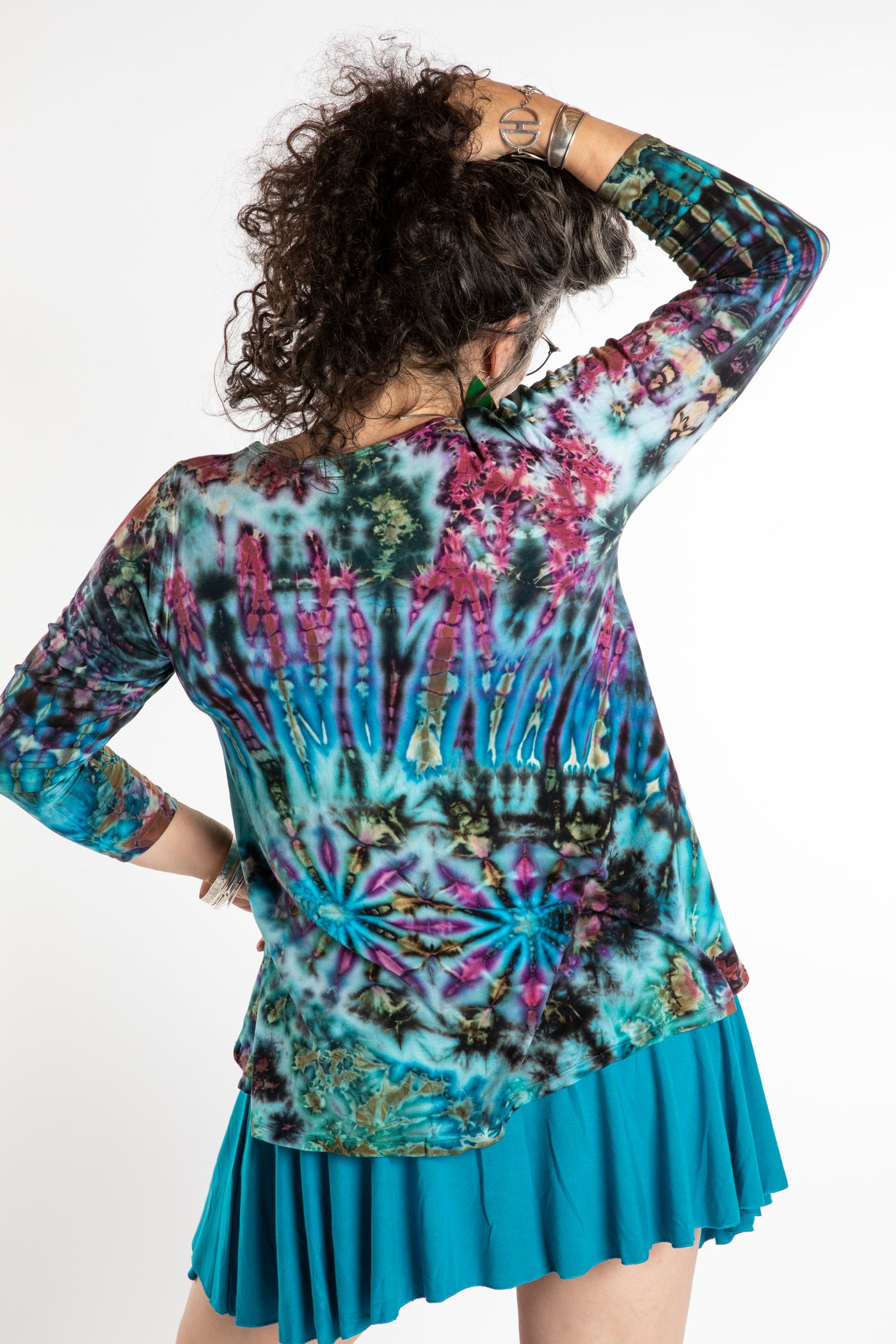 Susan wearing a blue tie dye shirt in Ocean