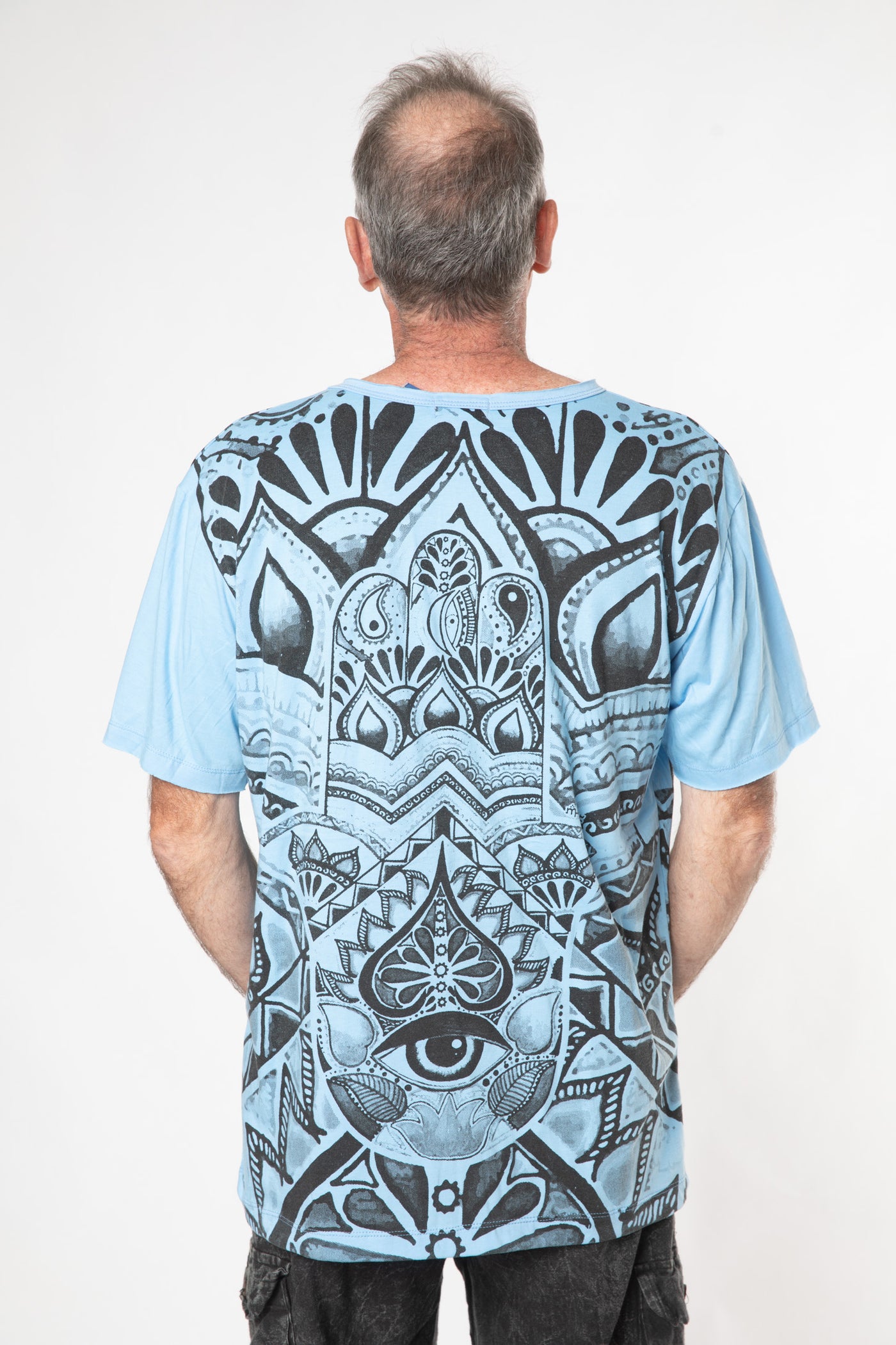 Ross is wearing size L light blue hamsa t shirt 