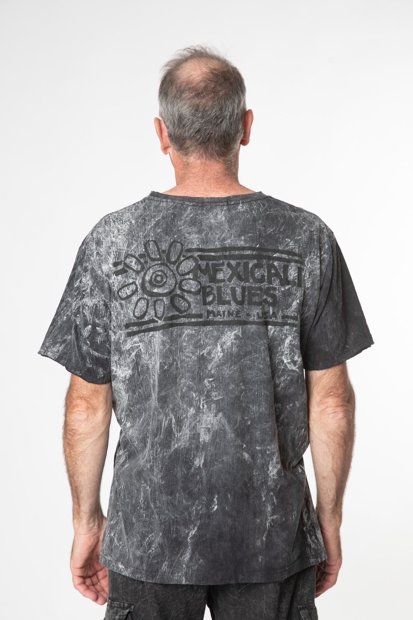 Ross is wearing size L cosmic t shirt in black 