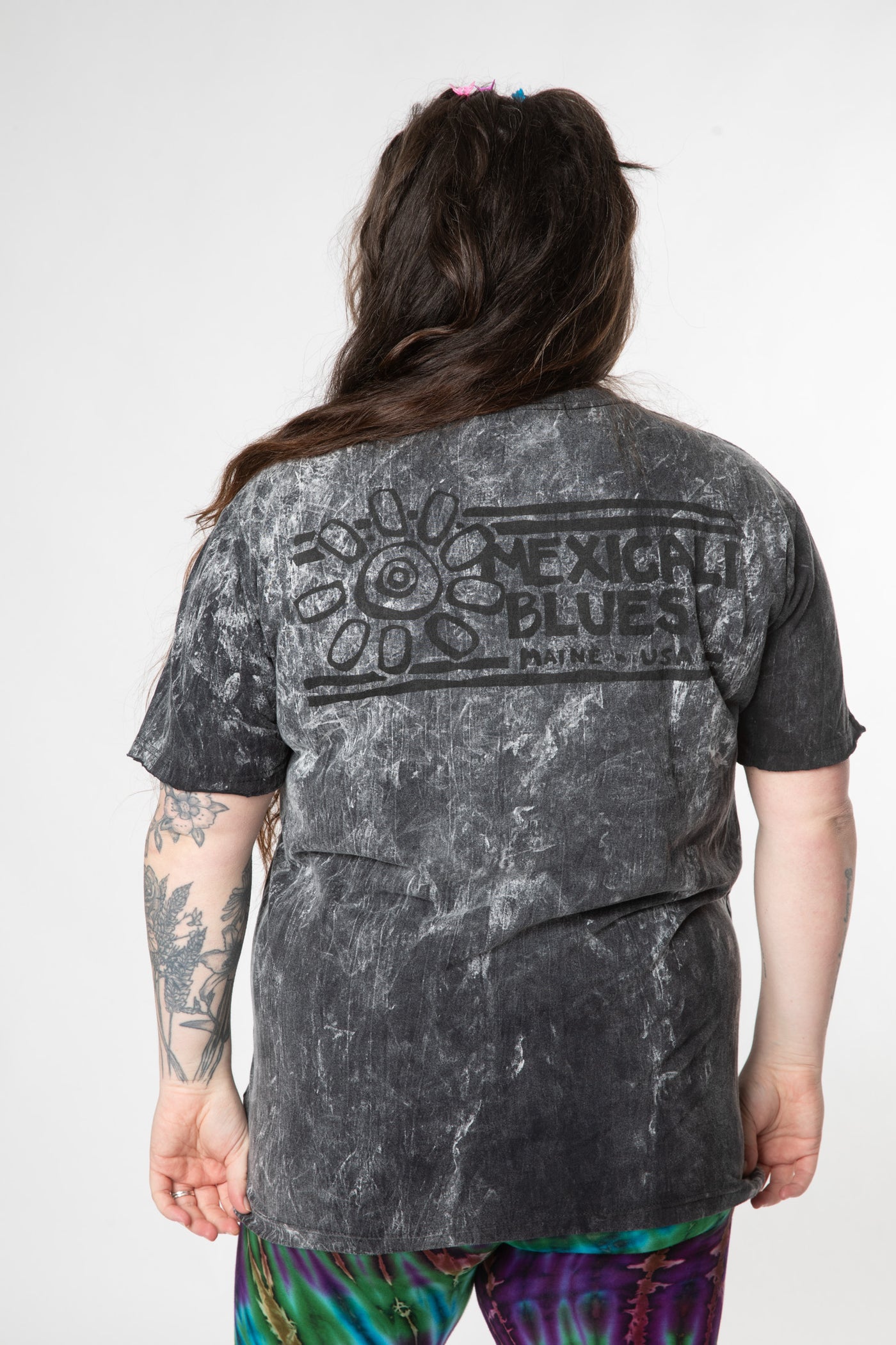 Desiree is wearing size L cosmic t shirt in black 