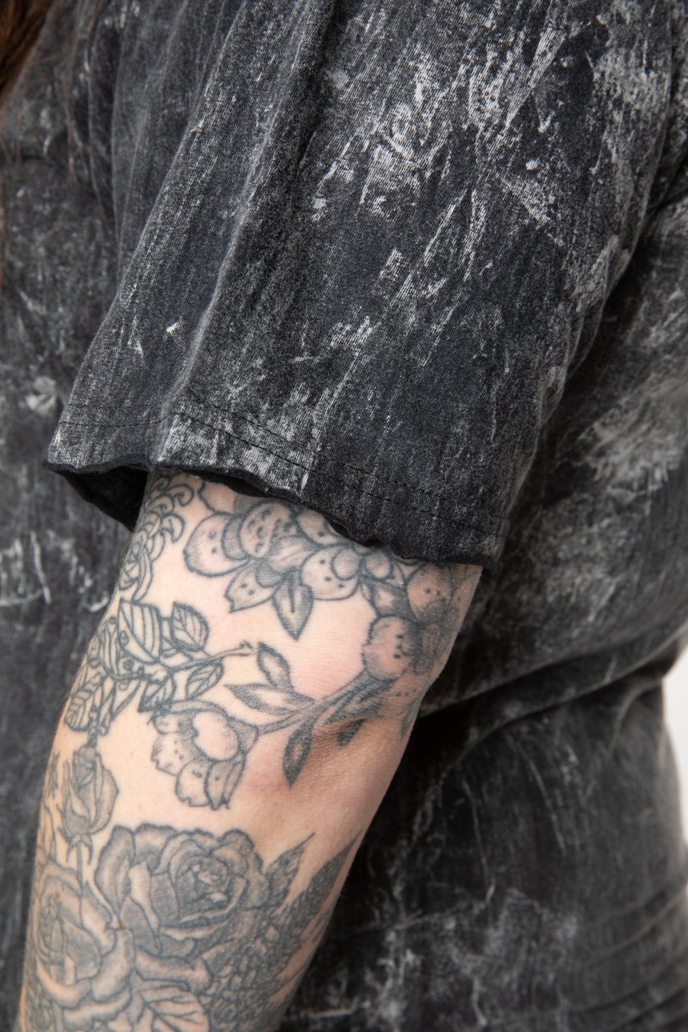 Desiree is wearing size L cosmic t shirt in black 