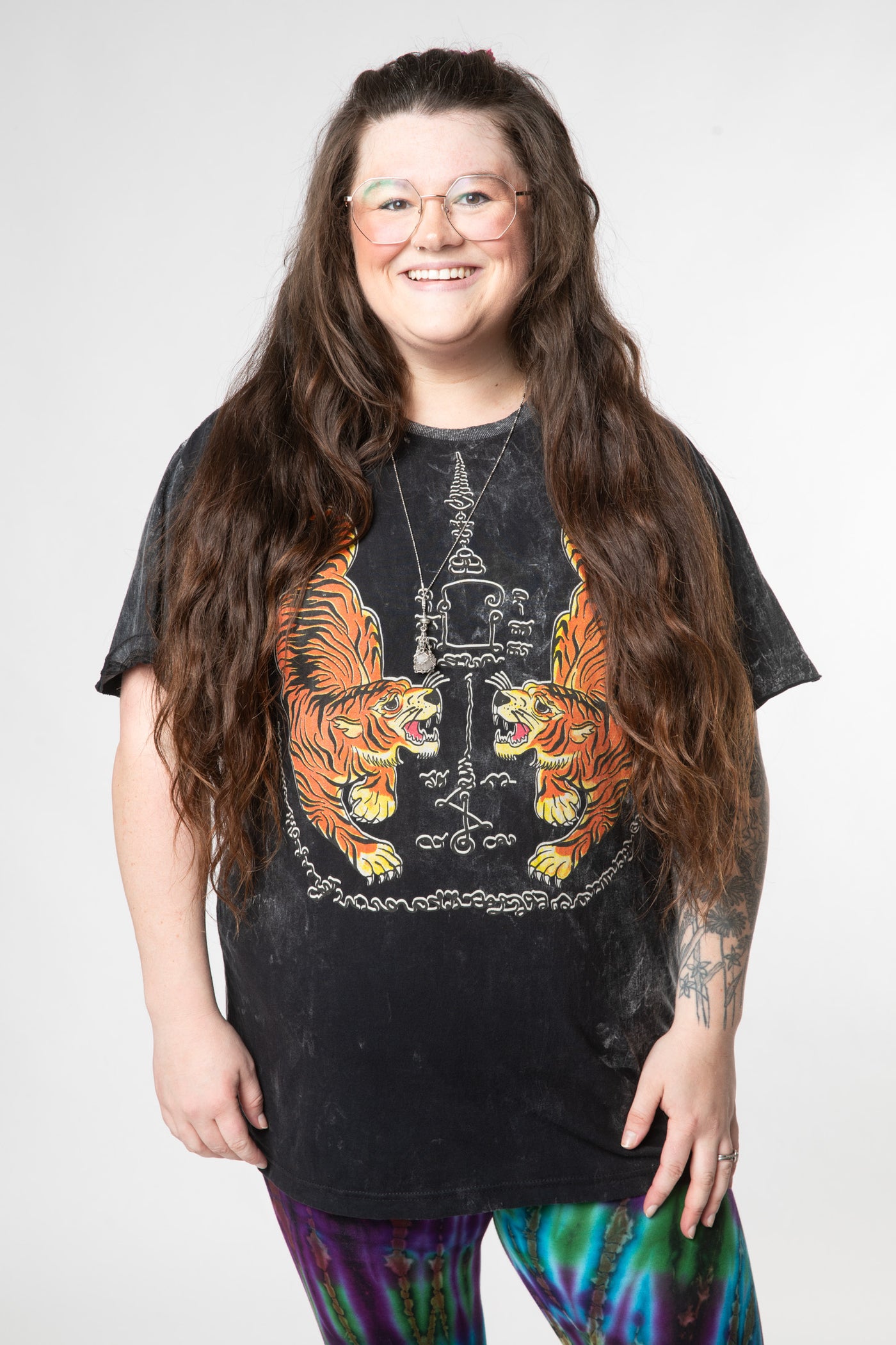 Desiree is wearing size L black tigers t shirt 