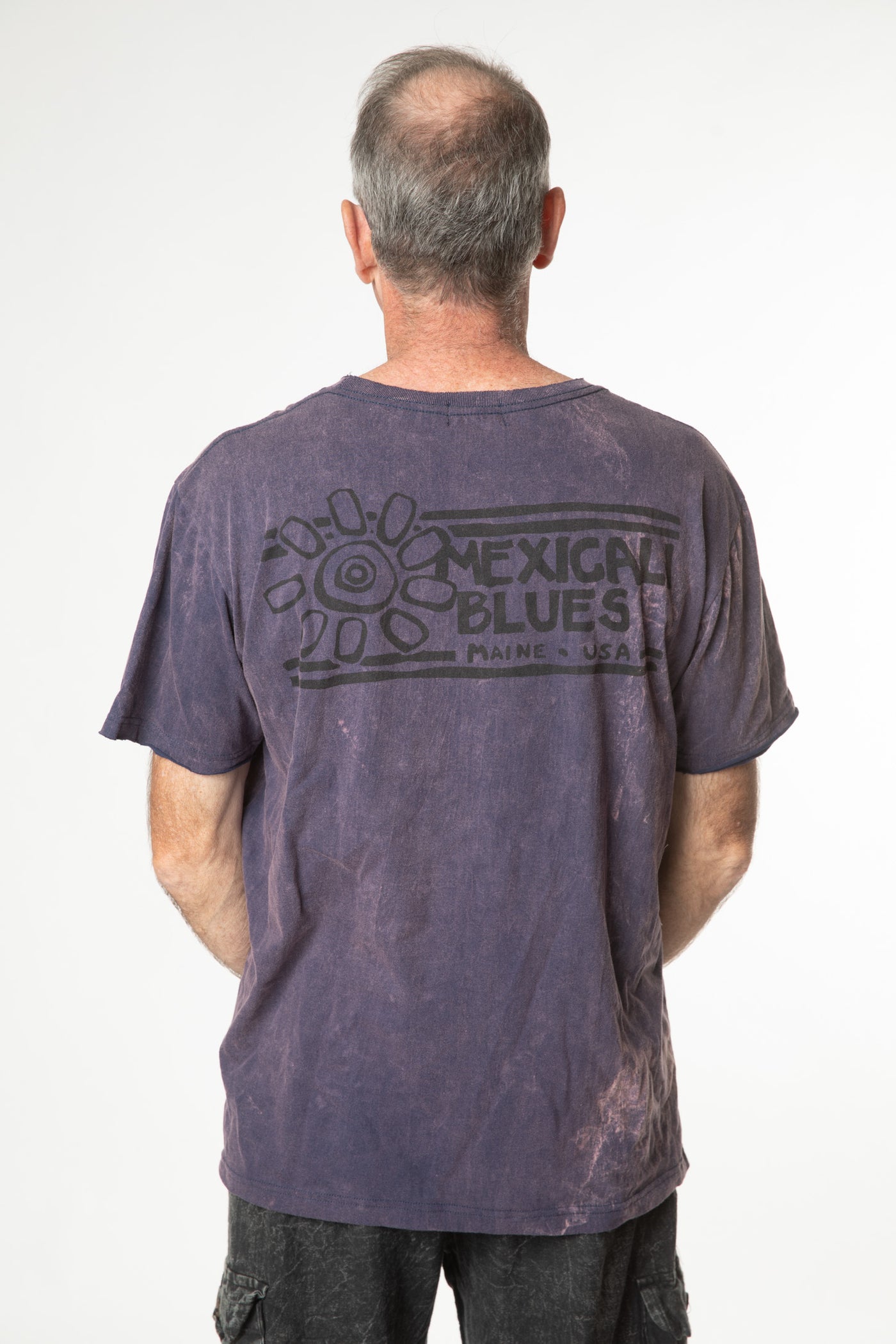 Ross is wearing size L cosmic t shirt in purple 
