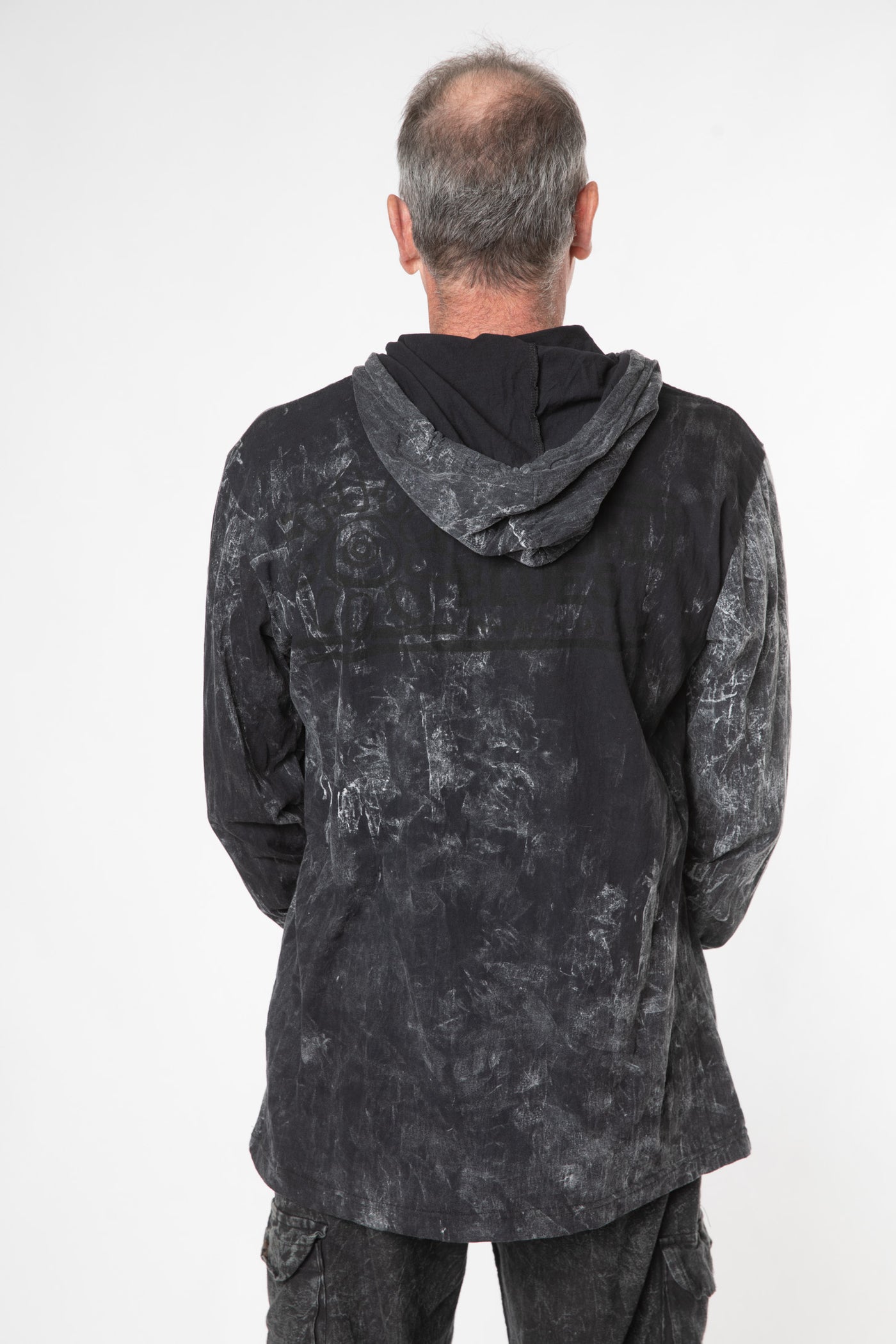 Ross is wearing size L black hamsa lightweight hoodie