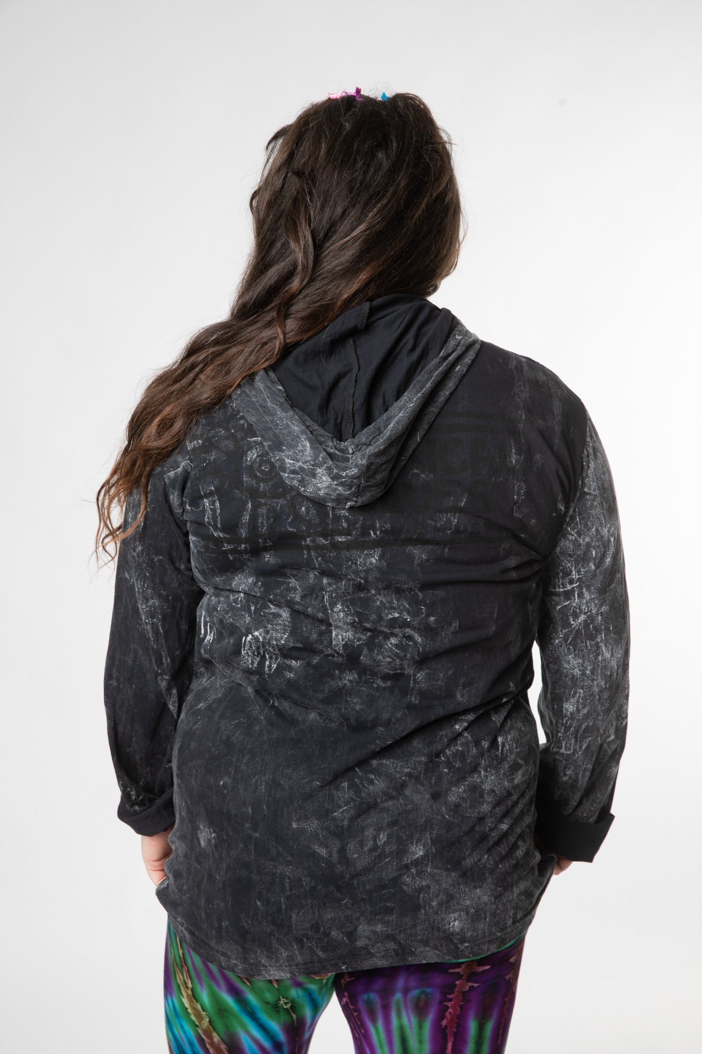 Desiree is wearing size L black hamsa lightweight hoodie