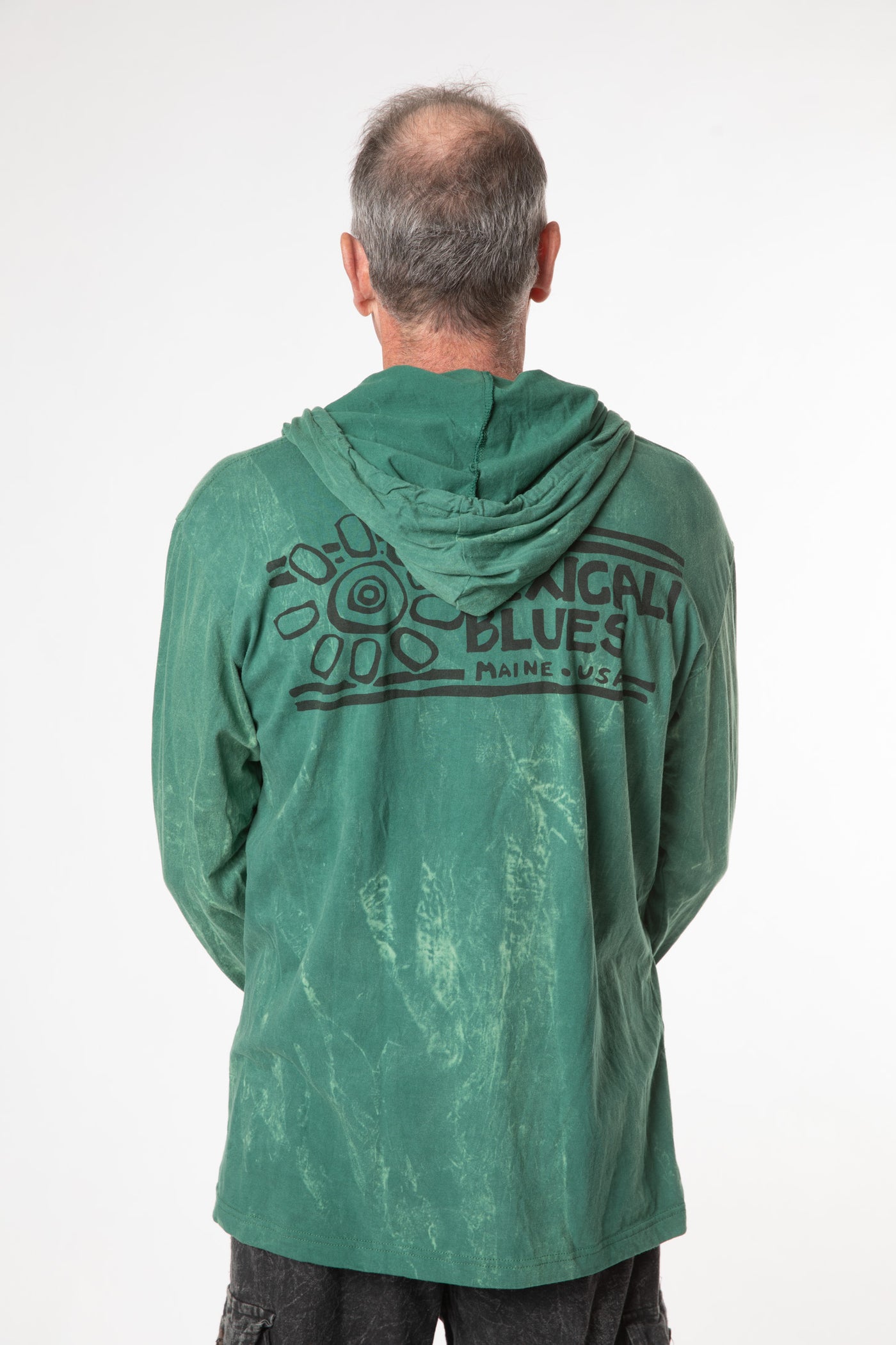 Ross is wearing size L green tree lightweight hoodie