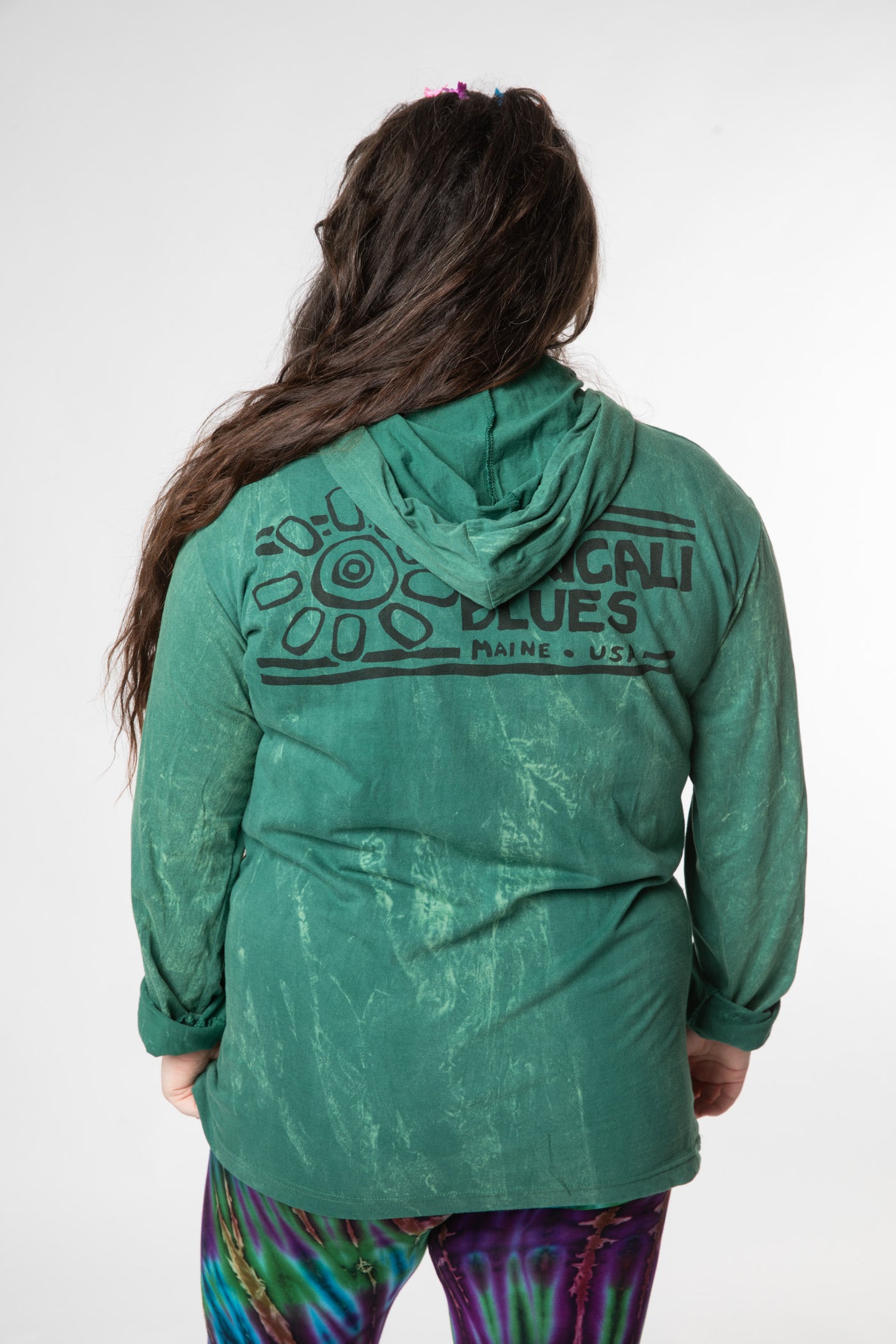 Desiree is wearing size L green tree lightweight hoodie
