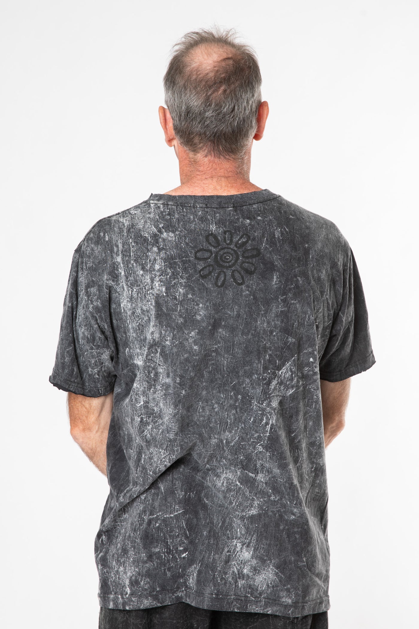 Ross is wearing size L stonewash t shirt in black 