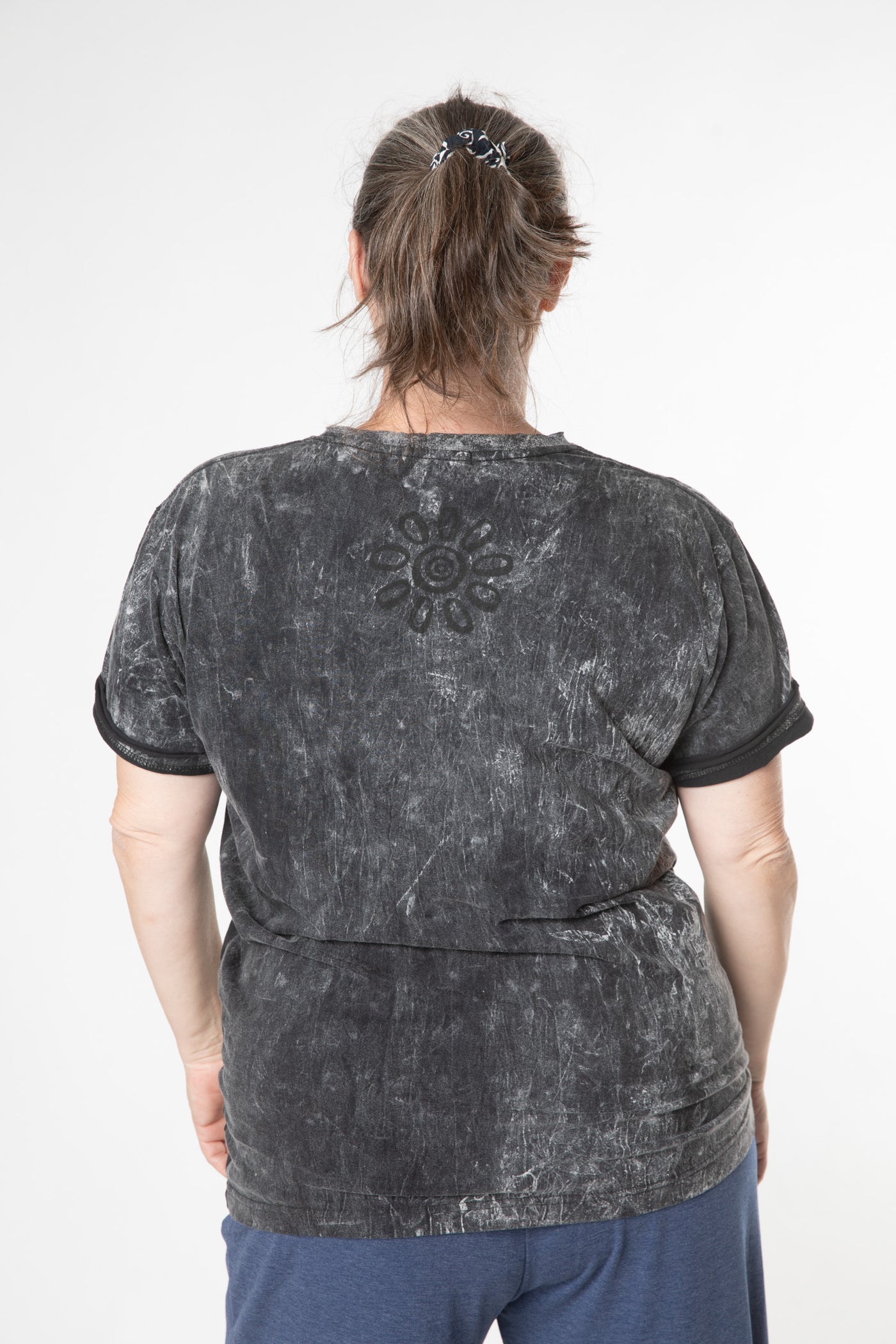 Jacqui is wearing size M stonewash t shirt in black 