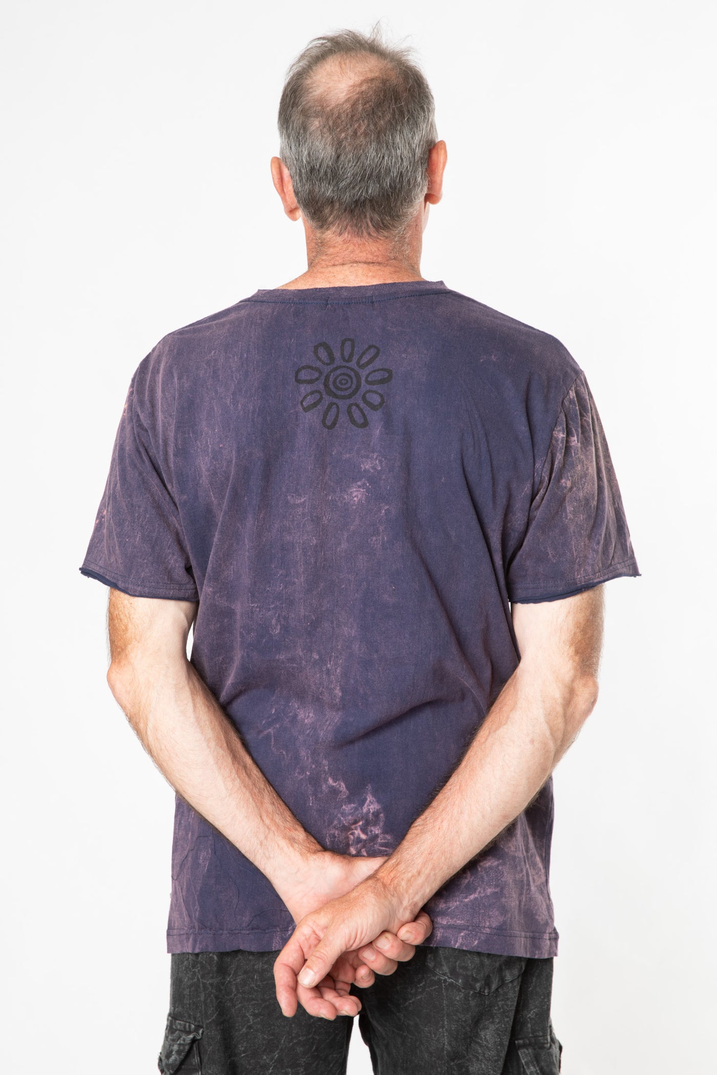 Ross is wearing size L stonewash t shirt in purple 