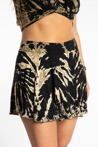 Sophie is wearing the S/M Black and White Mudmee Tie Dye Skort
