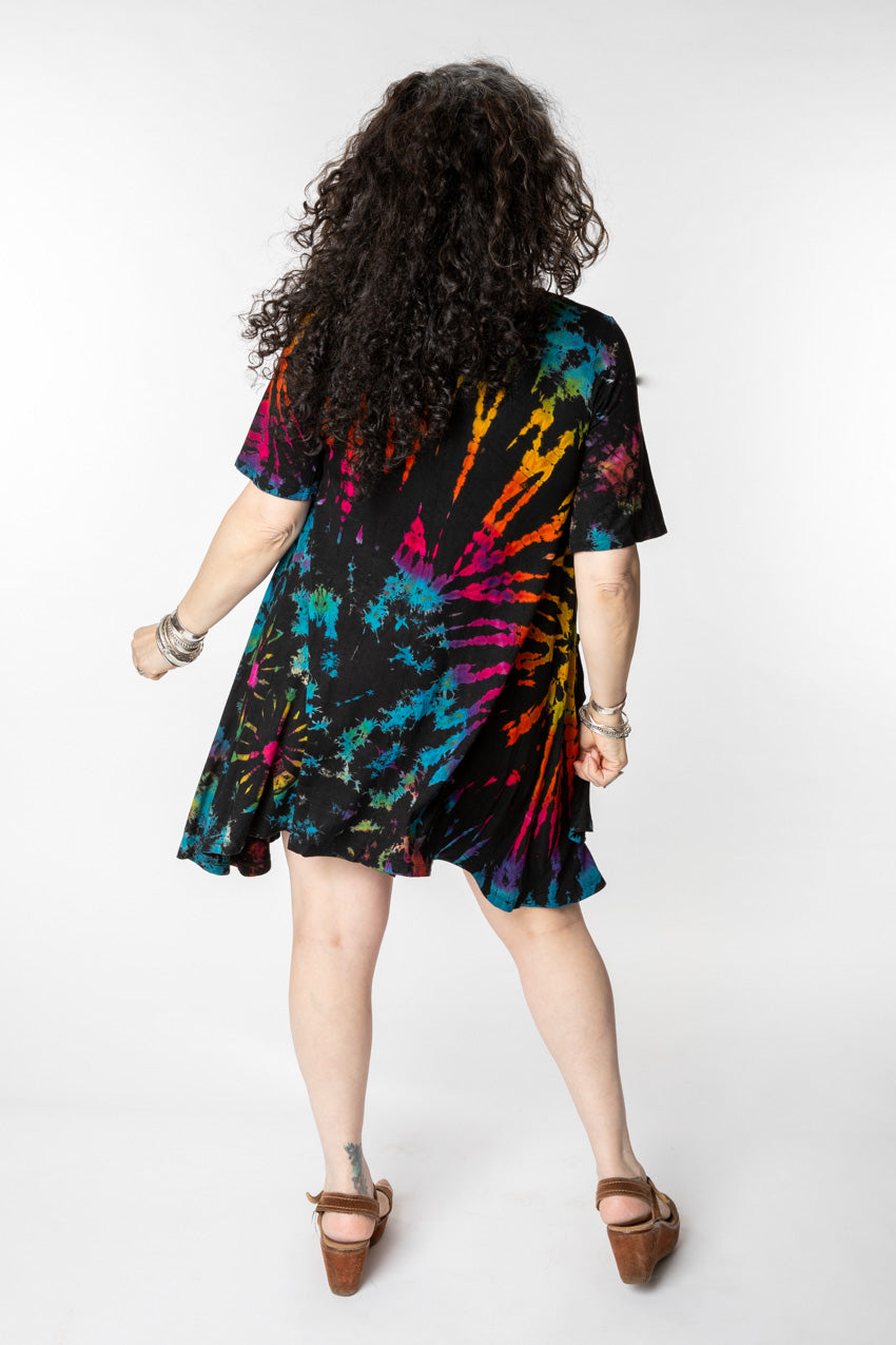 Susan is wearing a tie dye dress in black rainbow