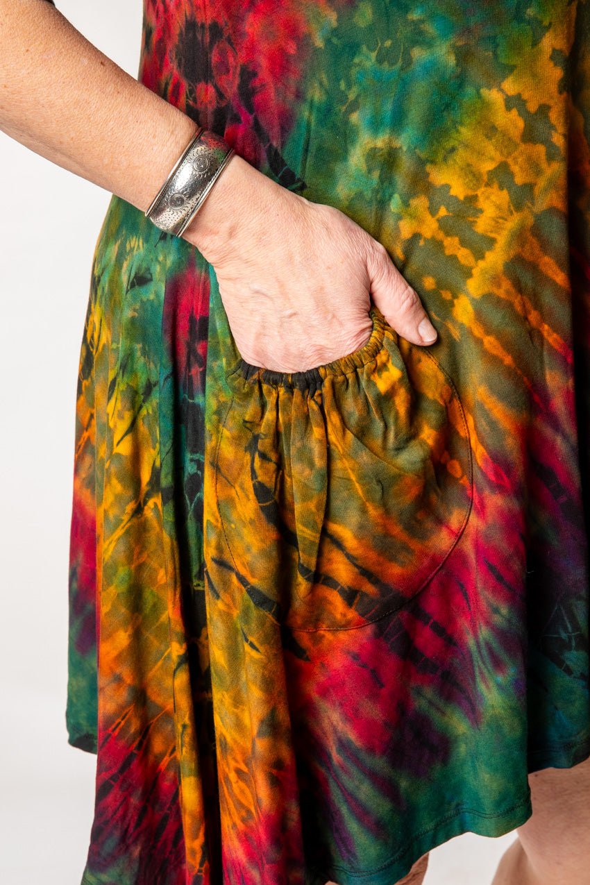 Betty is wearing a tie dye dress in green