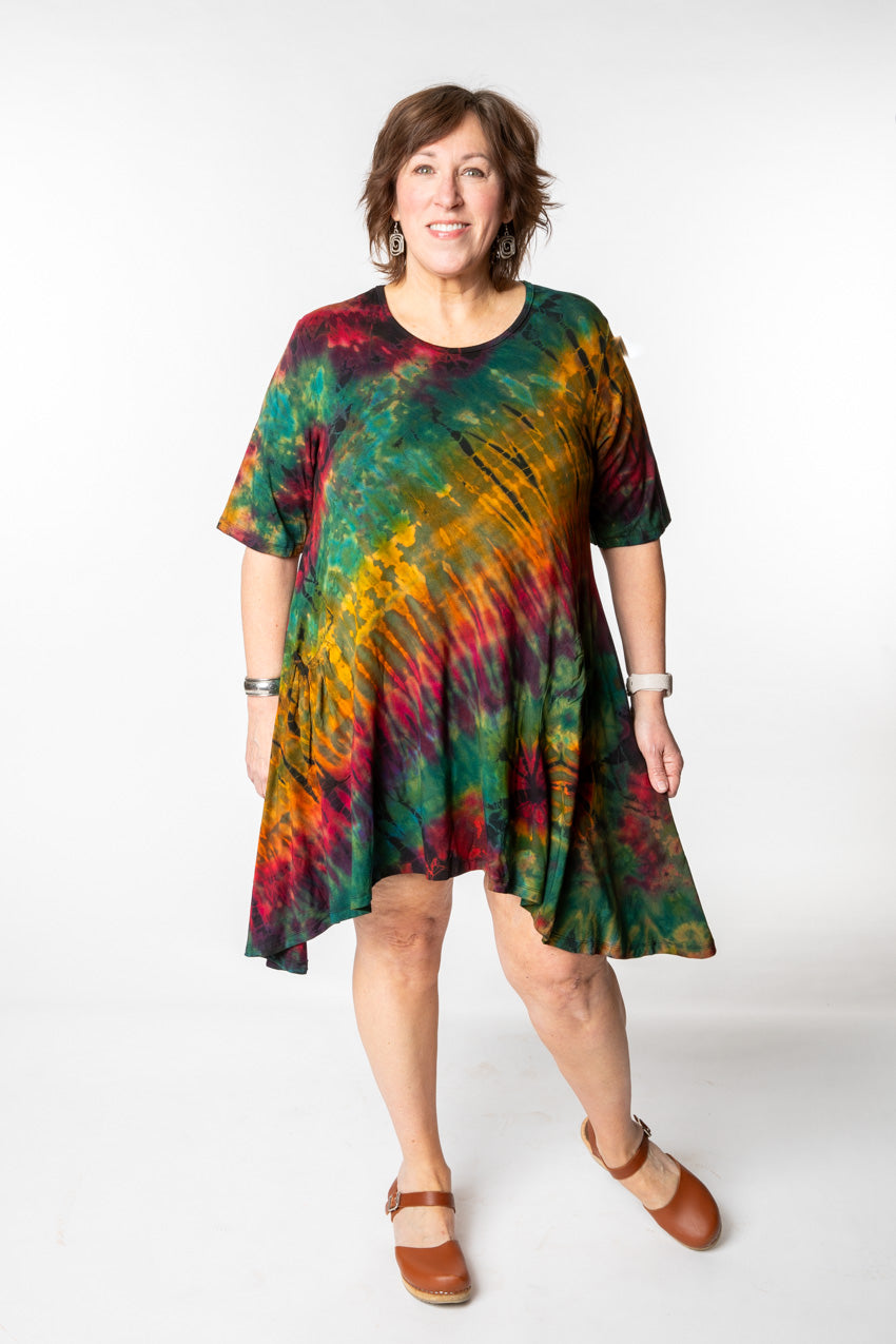 Betty is wearing a tie dye dress in green