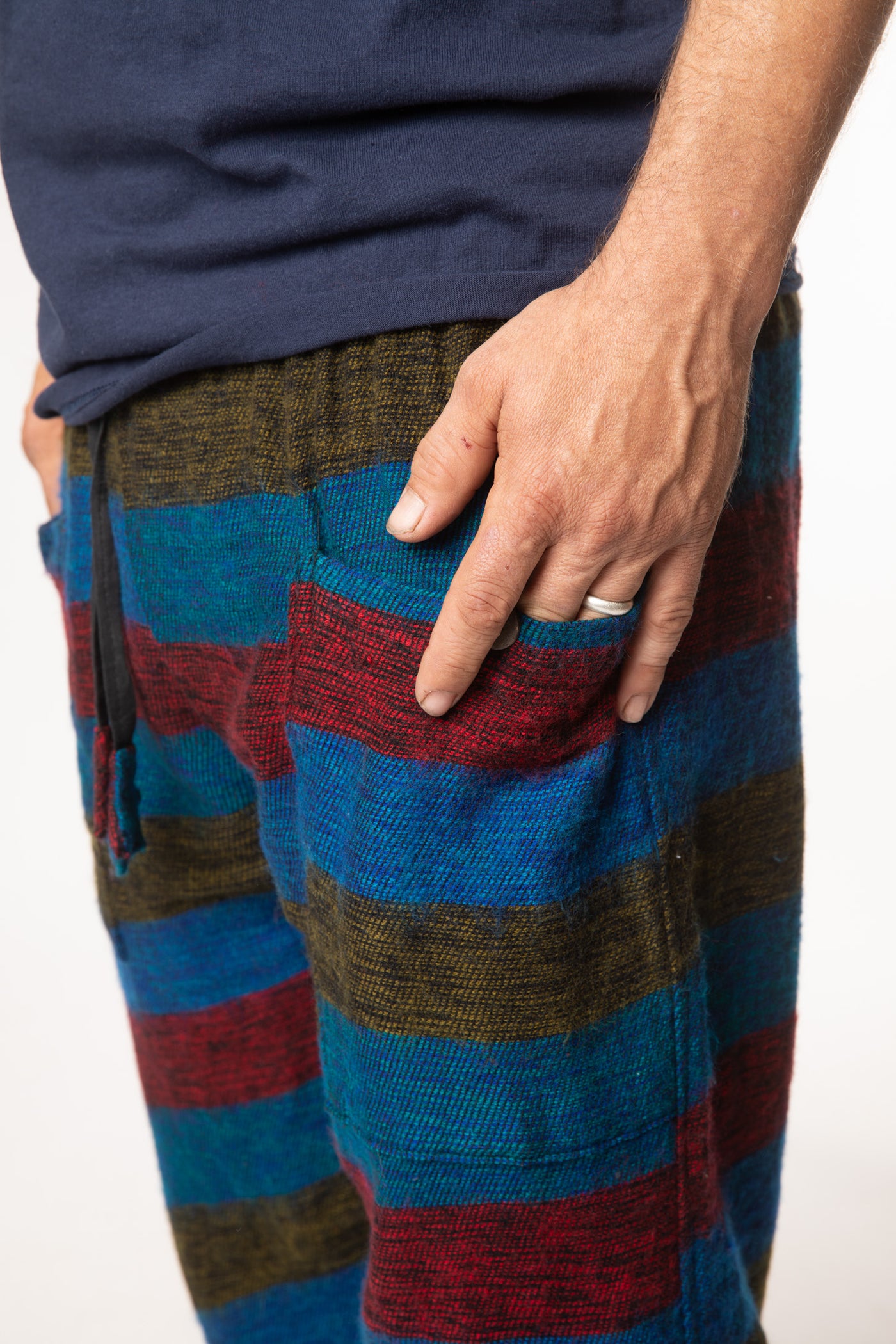 Harvey is wearing size M blanket pants in multicolor