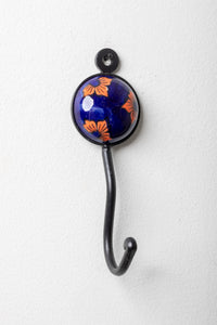 Round ceramic tile hook in blue and orange