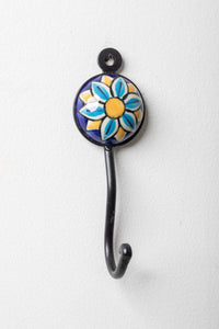 Round ceramic tile hook in blue and yellow