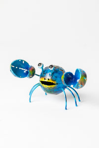 Painted tin crab sculpture in blue
