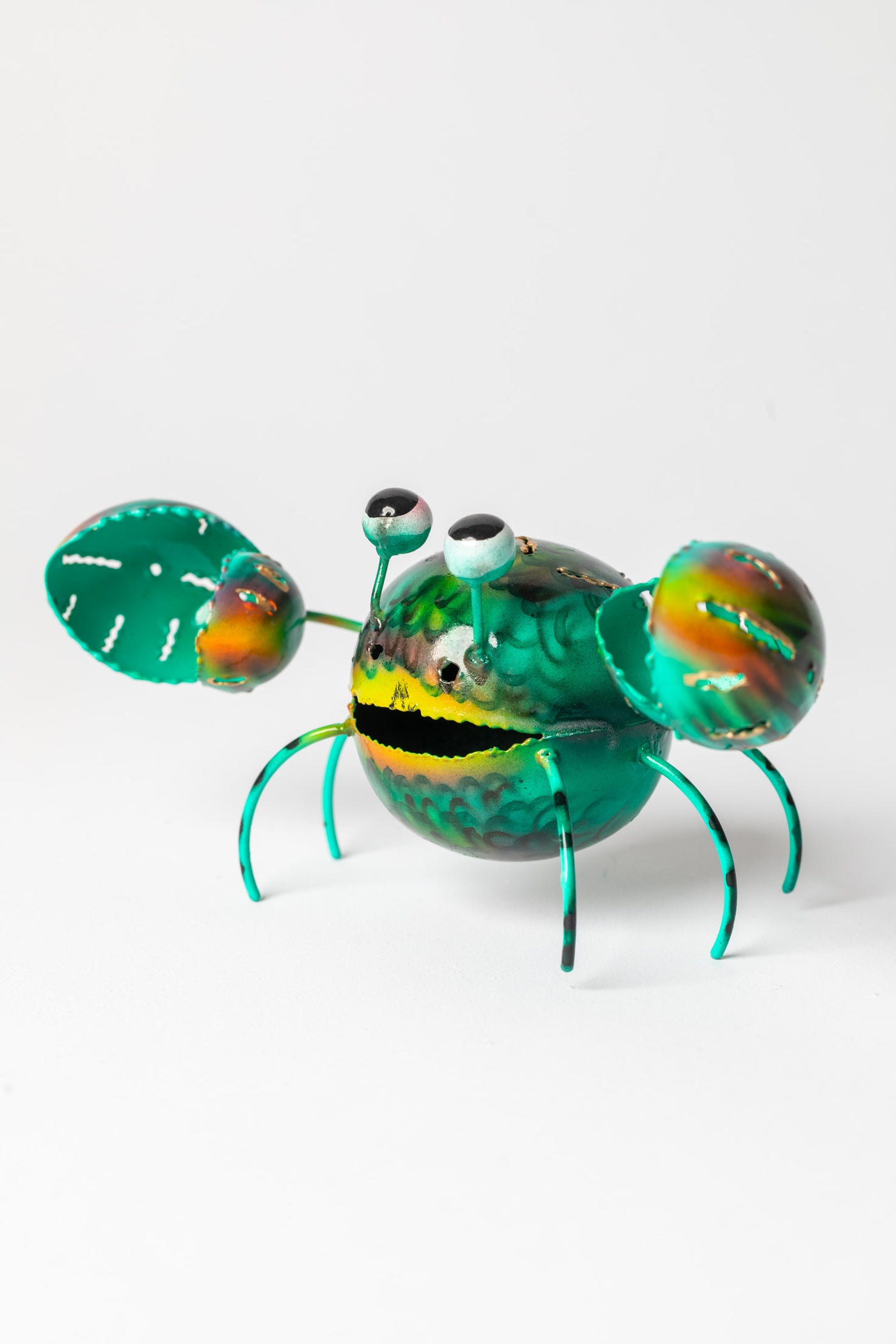 Painted tin crab sculpture in green