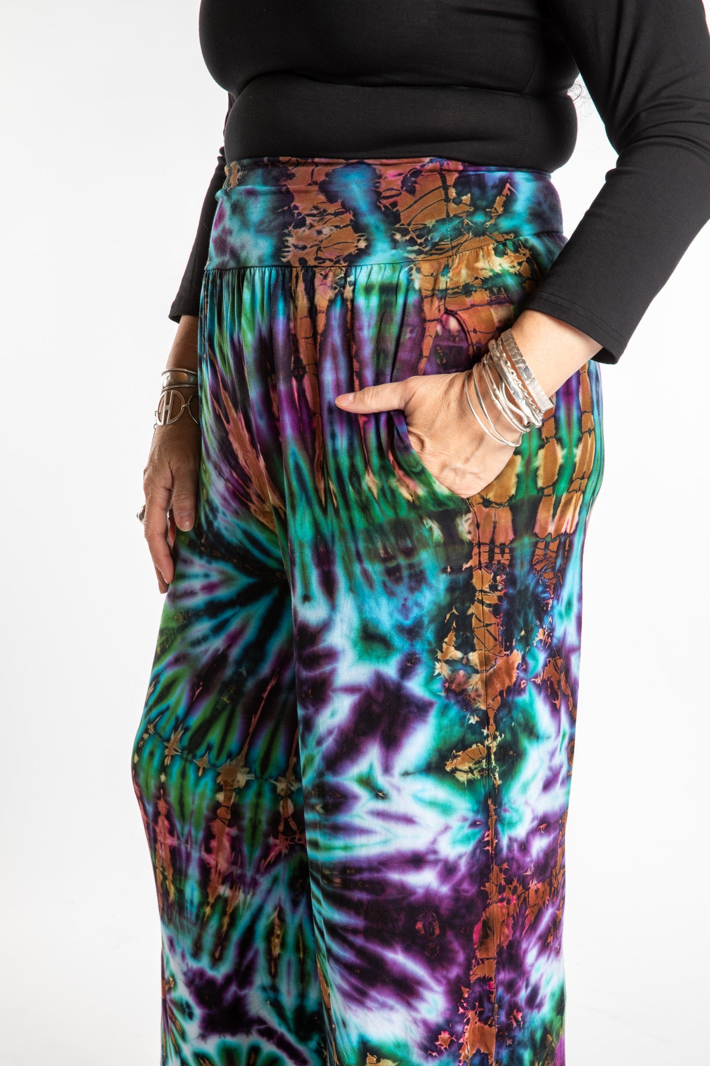 Susan wearing size S/M blue tie dye pants in Ocean