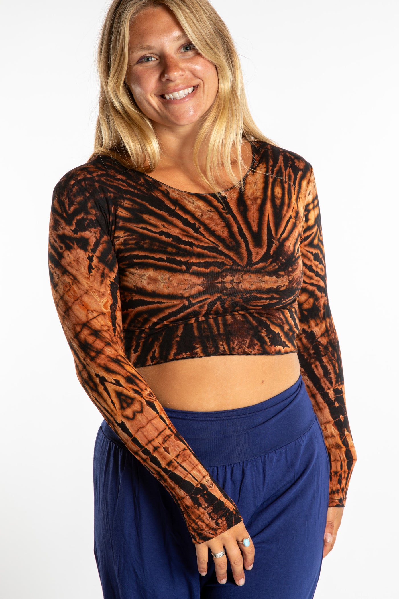 Sophie wearing a S/M orange tie dye long sleeve shirt in Black