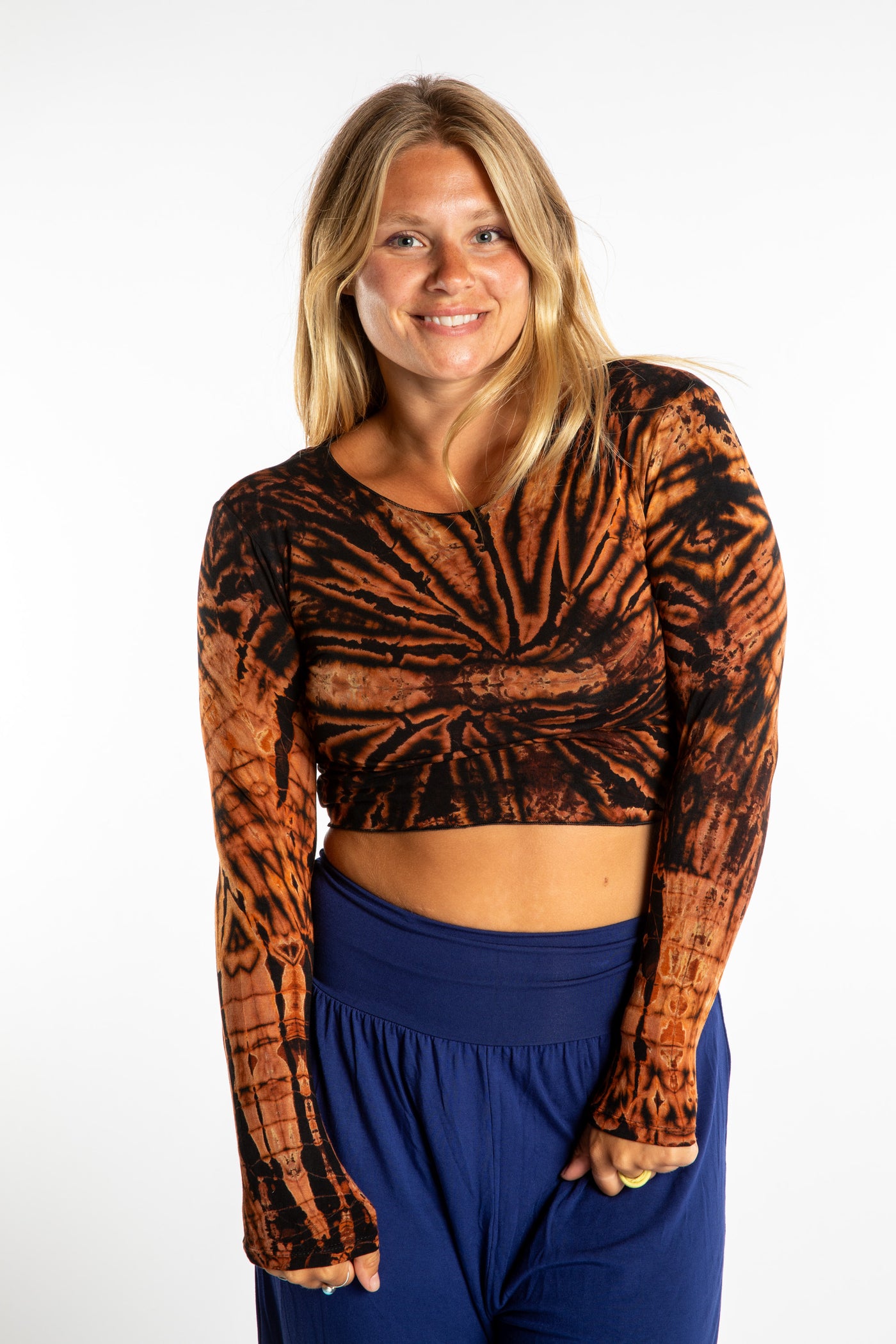 Sophie wearing a S/M orange tie dye long sleeve shirt in Black