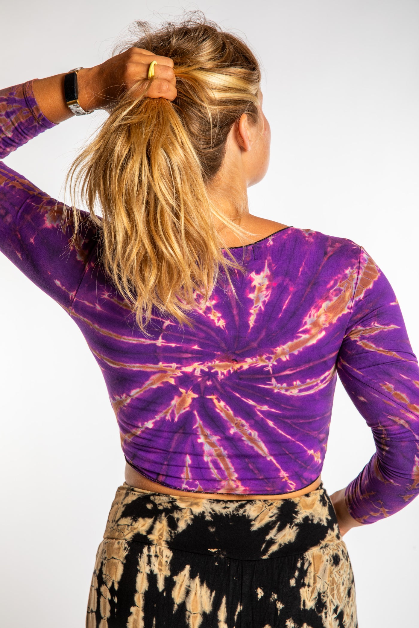 Sophie wearing a S/M tie dye long sleeve shirt in Purple