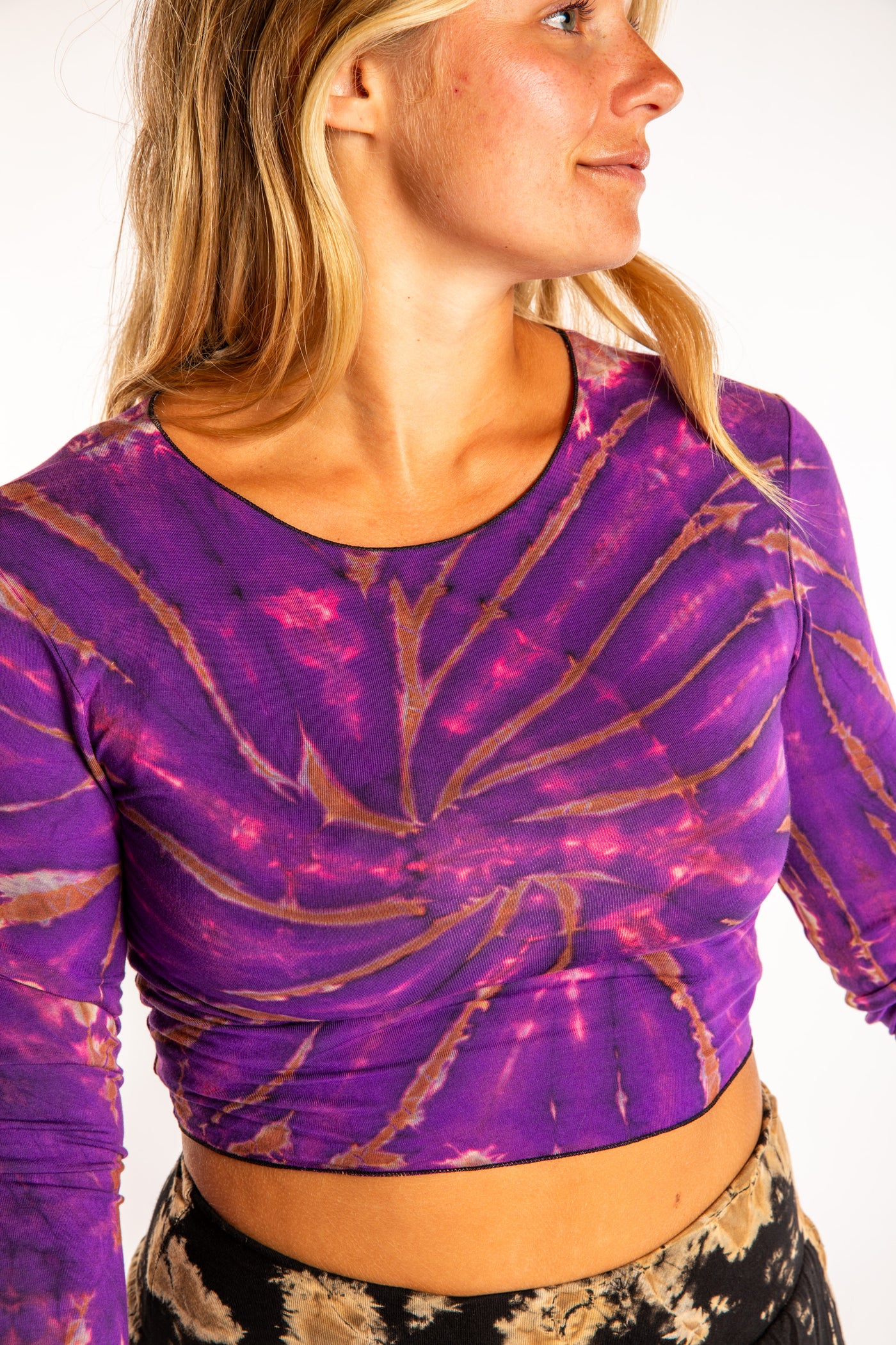 Sophie wearing a S/M tie dye long sleeve shirt in Purple