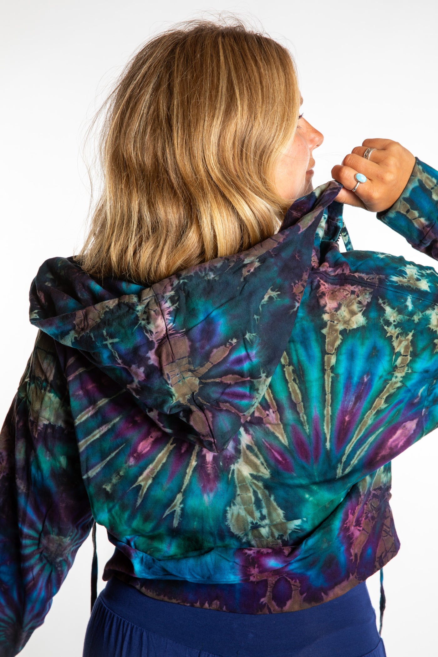 Sophie wearing a S/M blue tie dye cropped hoodie in Ocean