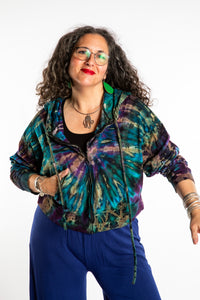 Susan wearing a M/L blue tie dye cropped hoodie in Ocean