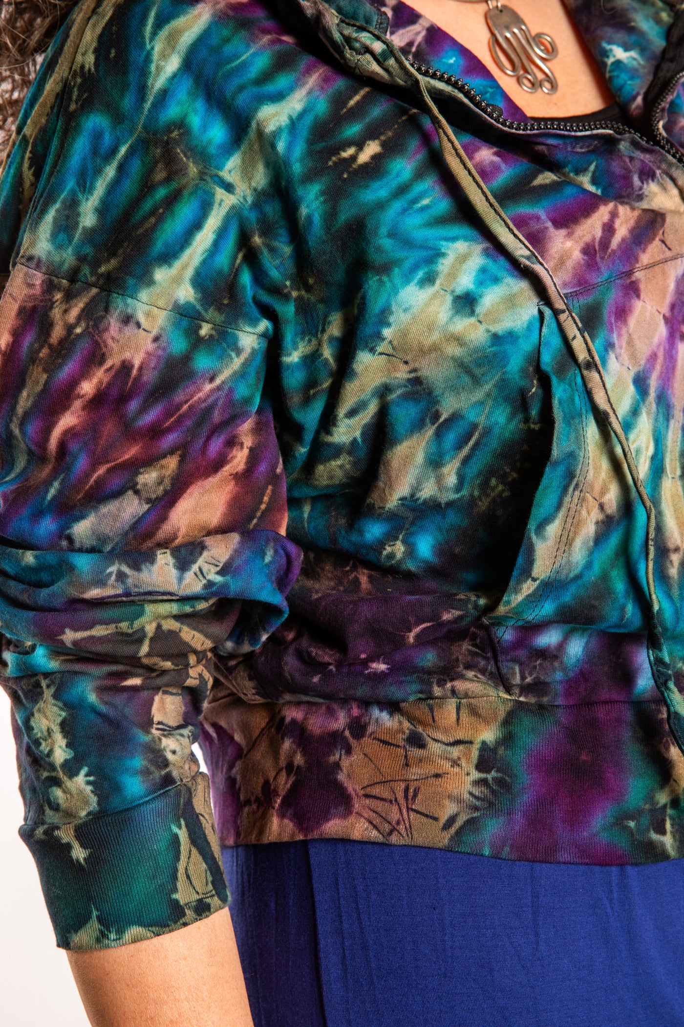 Susan wearing a M/L blue tie dye cropped hoodie in Ocean