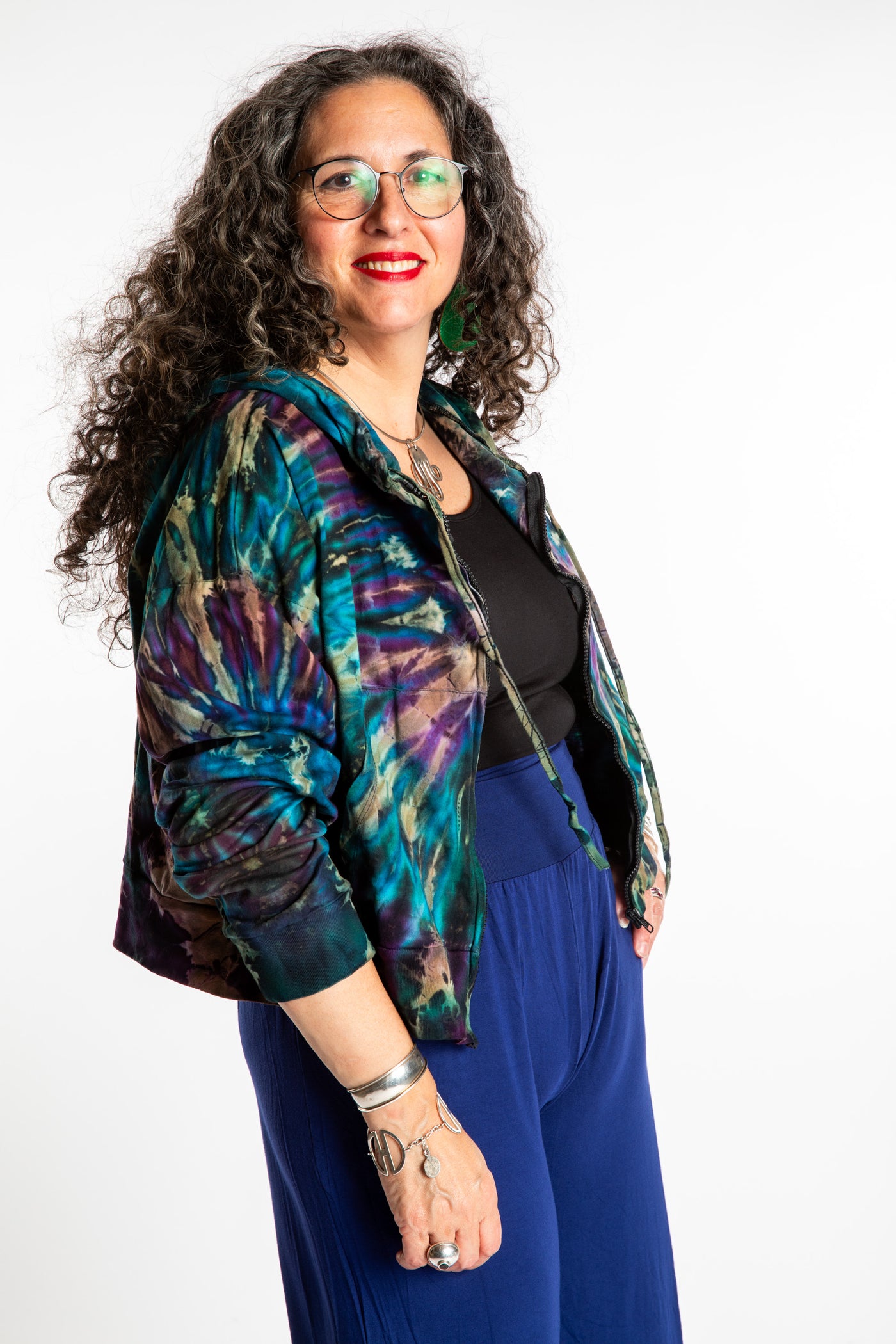 Susan wearing a M/L blue tie dye cropped hoodie in Ocean
