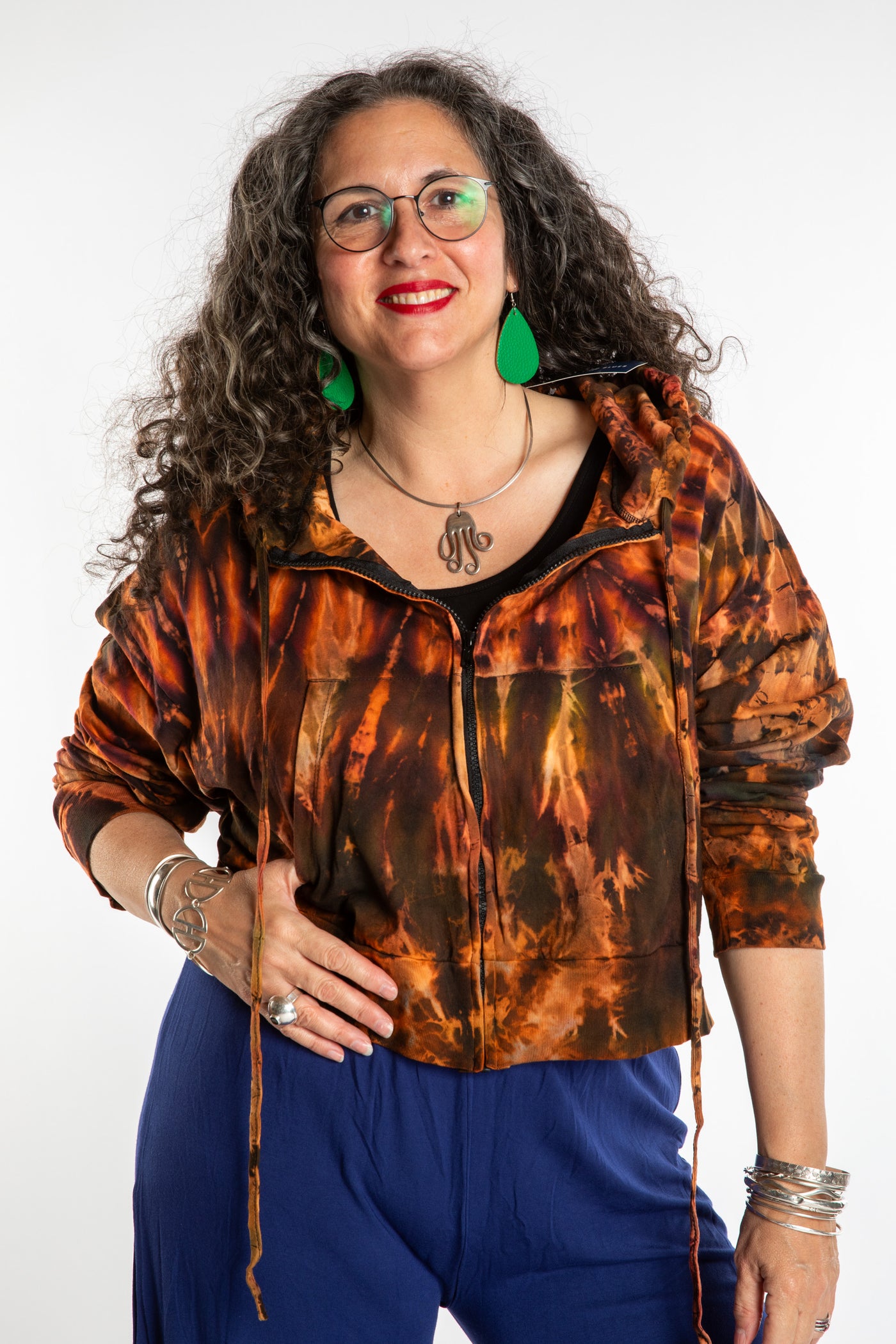 Susan wearing a M/L orange tie dye cropped hoodie in Sunset