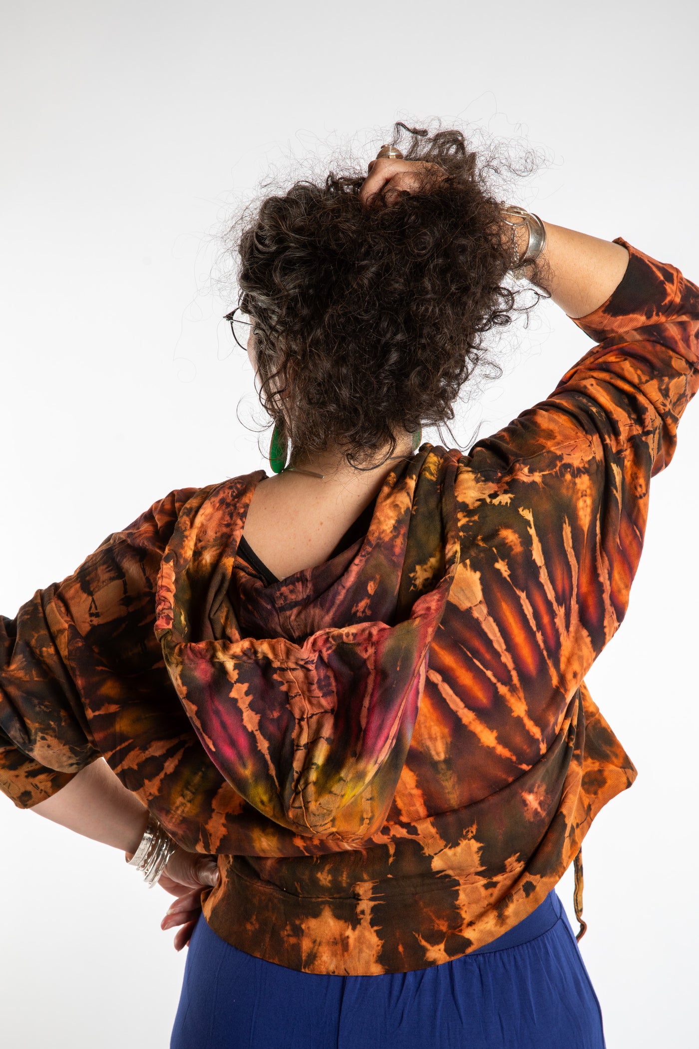 Susan wearing a M/L orange tie dye cropped hoodie in Sunset