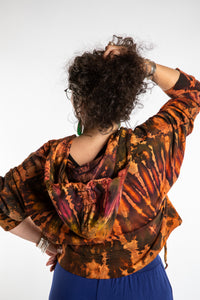 Susan wearing a M/L orange tie dye cropped hoodie in Sunset