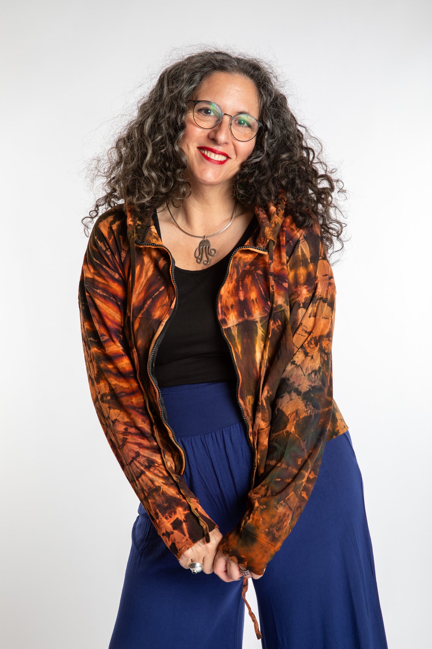 Susan wearing a M/L orange tie dye cropped hoodie in Sunset